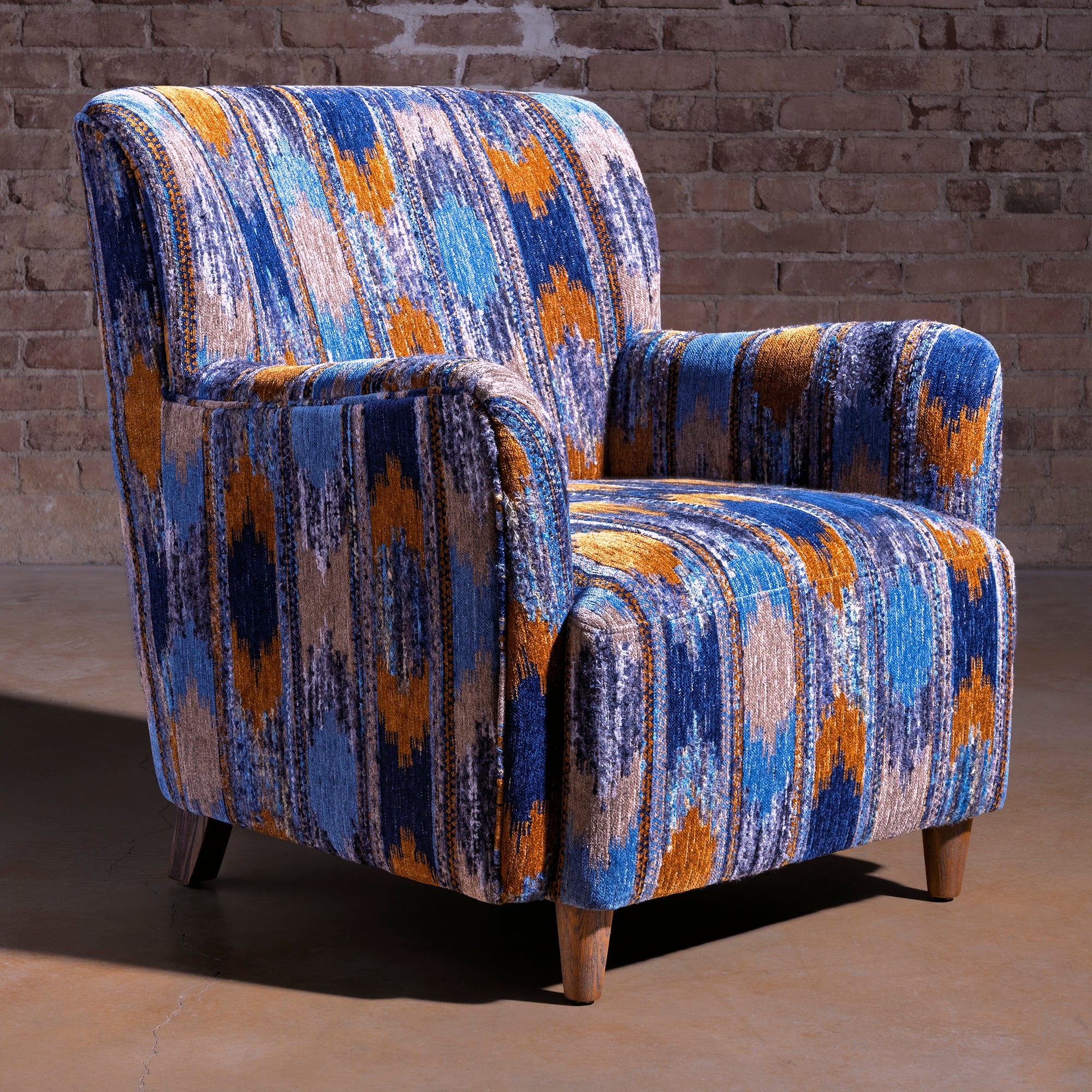 Cerulean Chimayo accent chair with blue patterned upholstery and wood legs