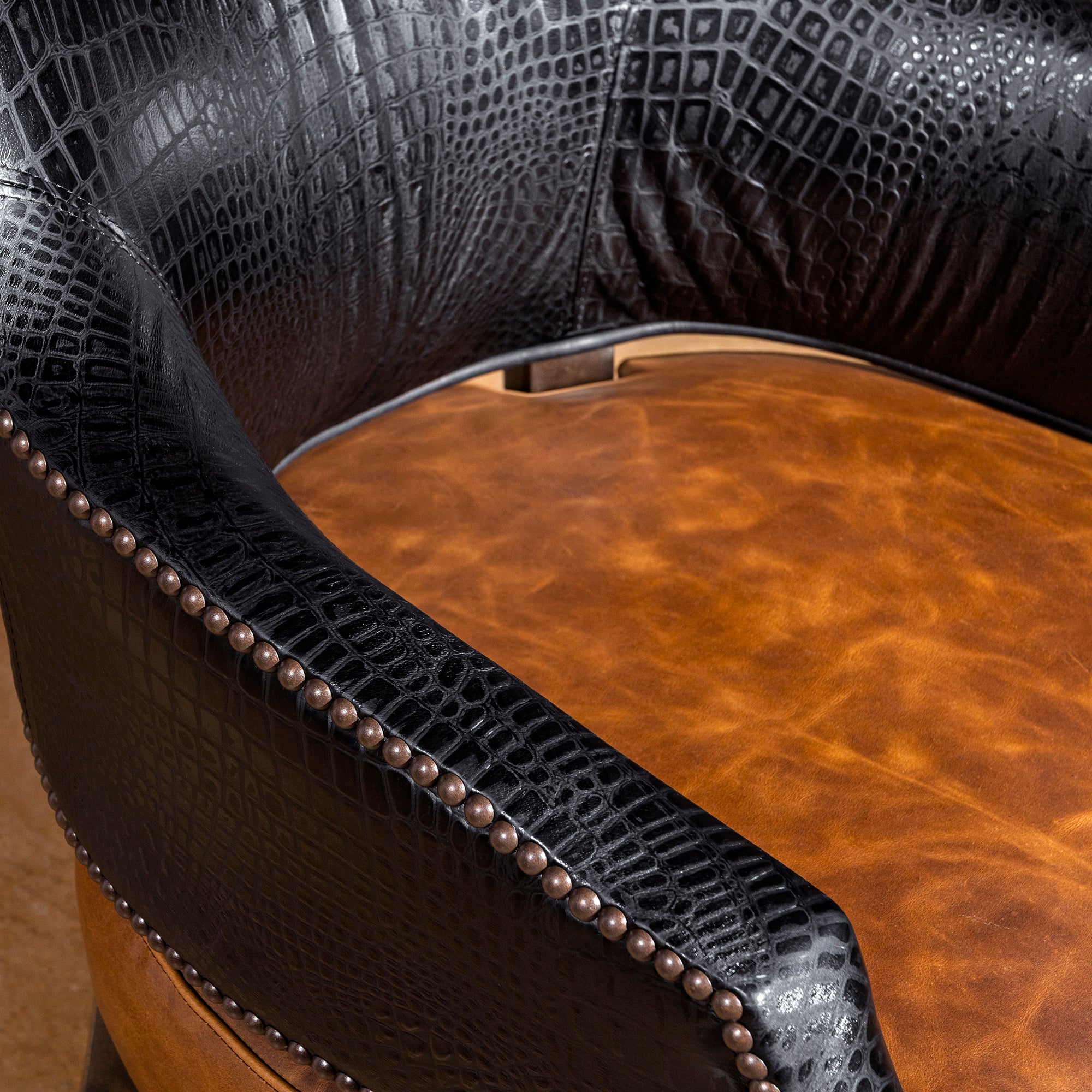 Seat closeup of saddle-toned top-grain leather on luxury Western poker and dining chair
