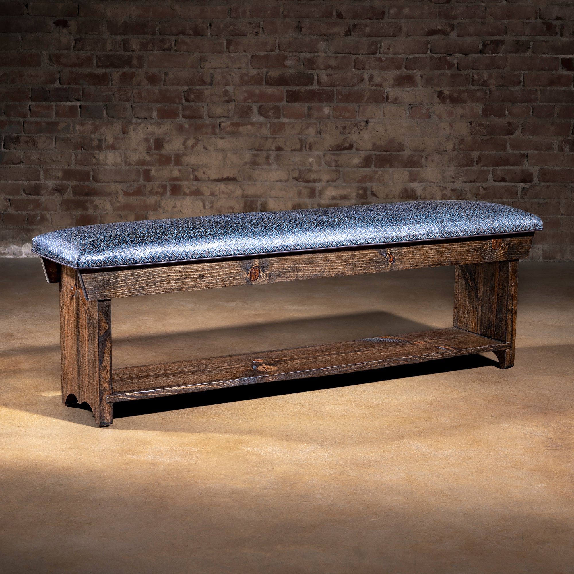 Silver-blue basketweave leather Western bench with dark stained wood base and lower storage shelf