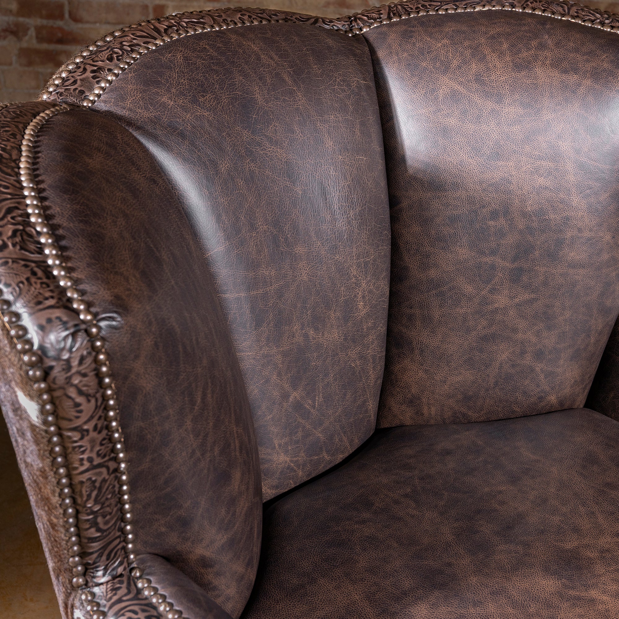 Conch Canyon Swivel Chair backrest with distressed top-grain leather upholstery