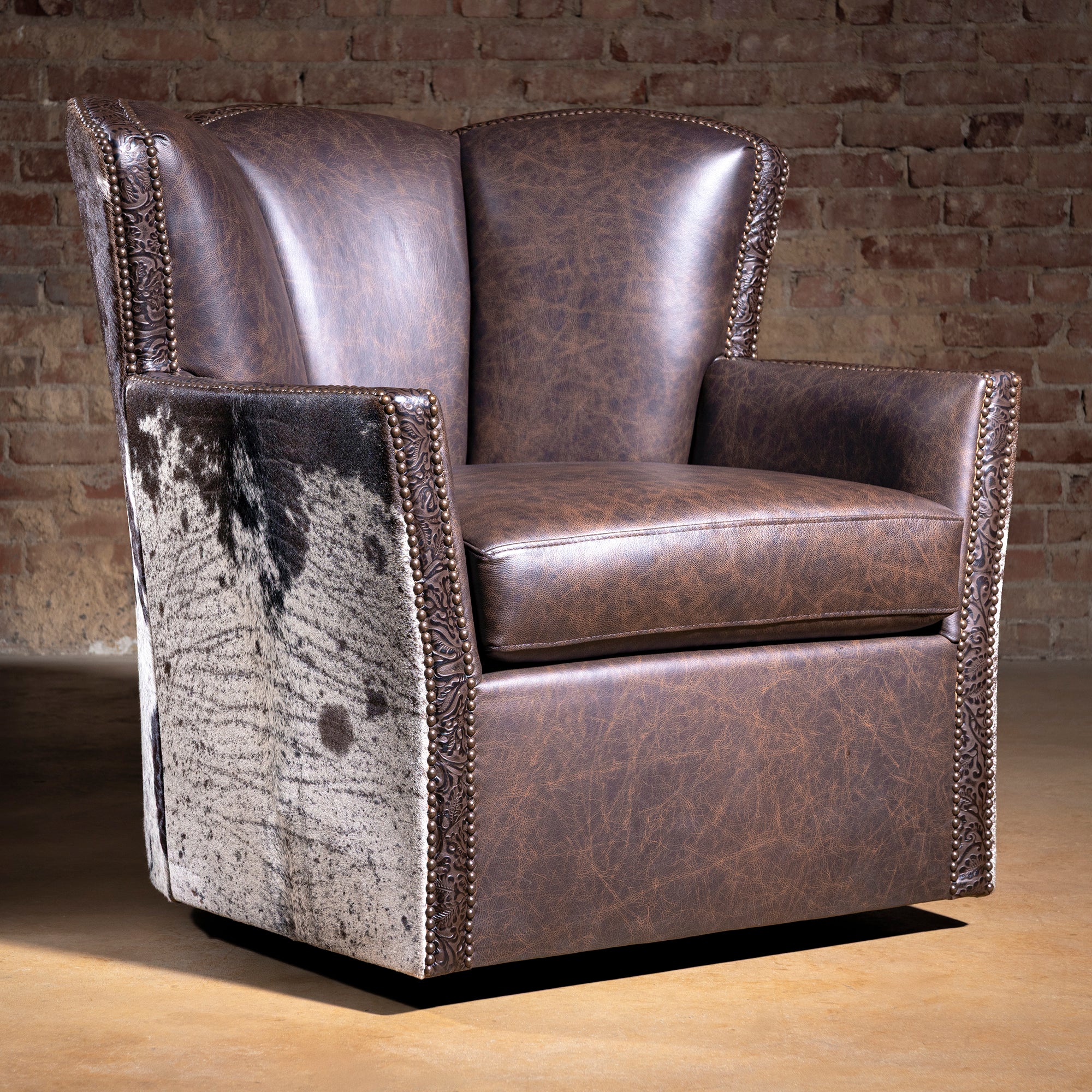 Conch Canyon Swivel Chair in Brazilian cowhide and top-grain leather western accent chair