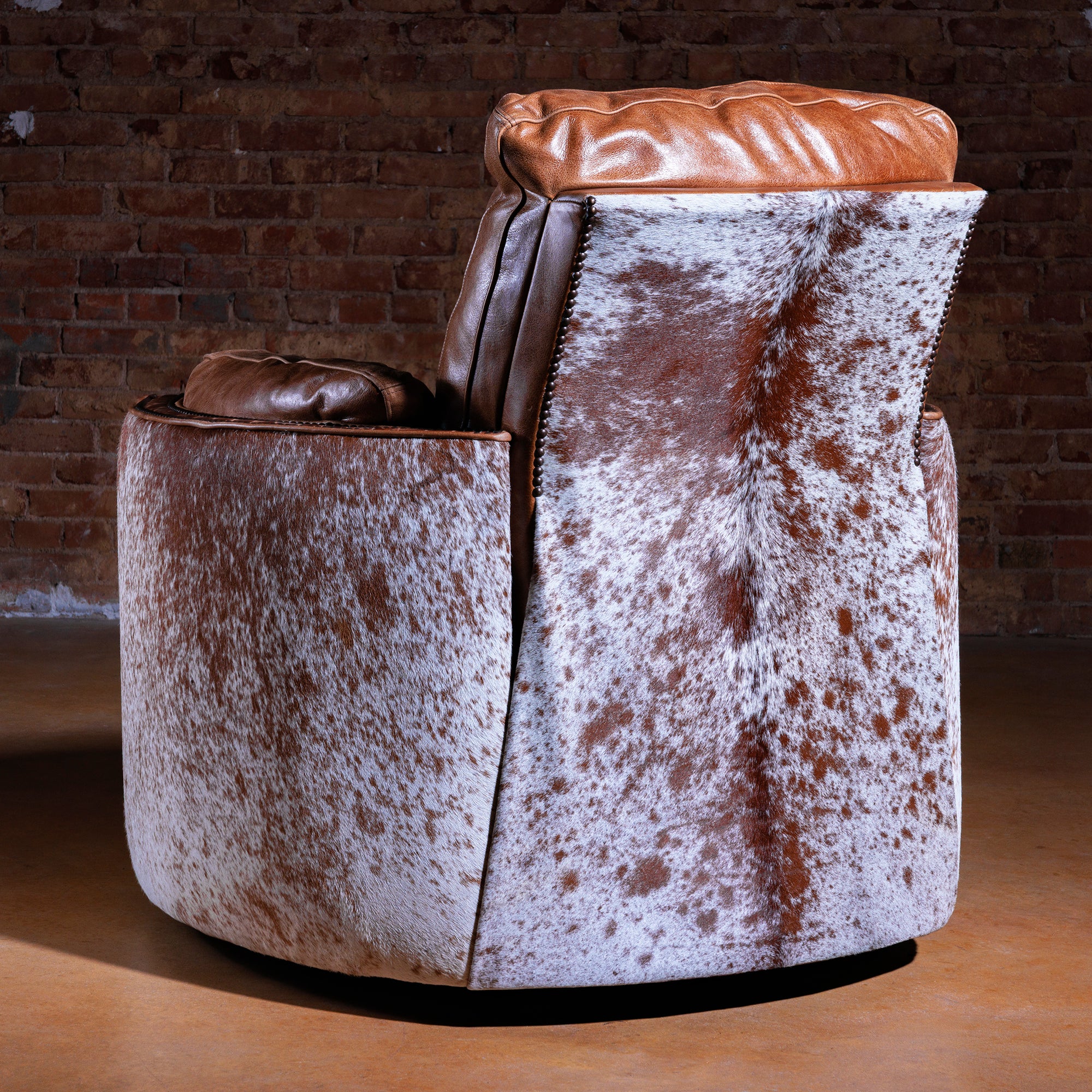 Rear view of Western cuddler recliner wrapped in Brazilian cowhide