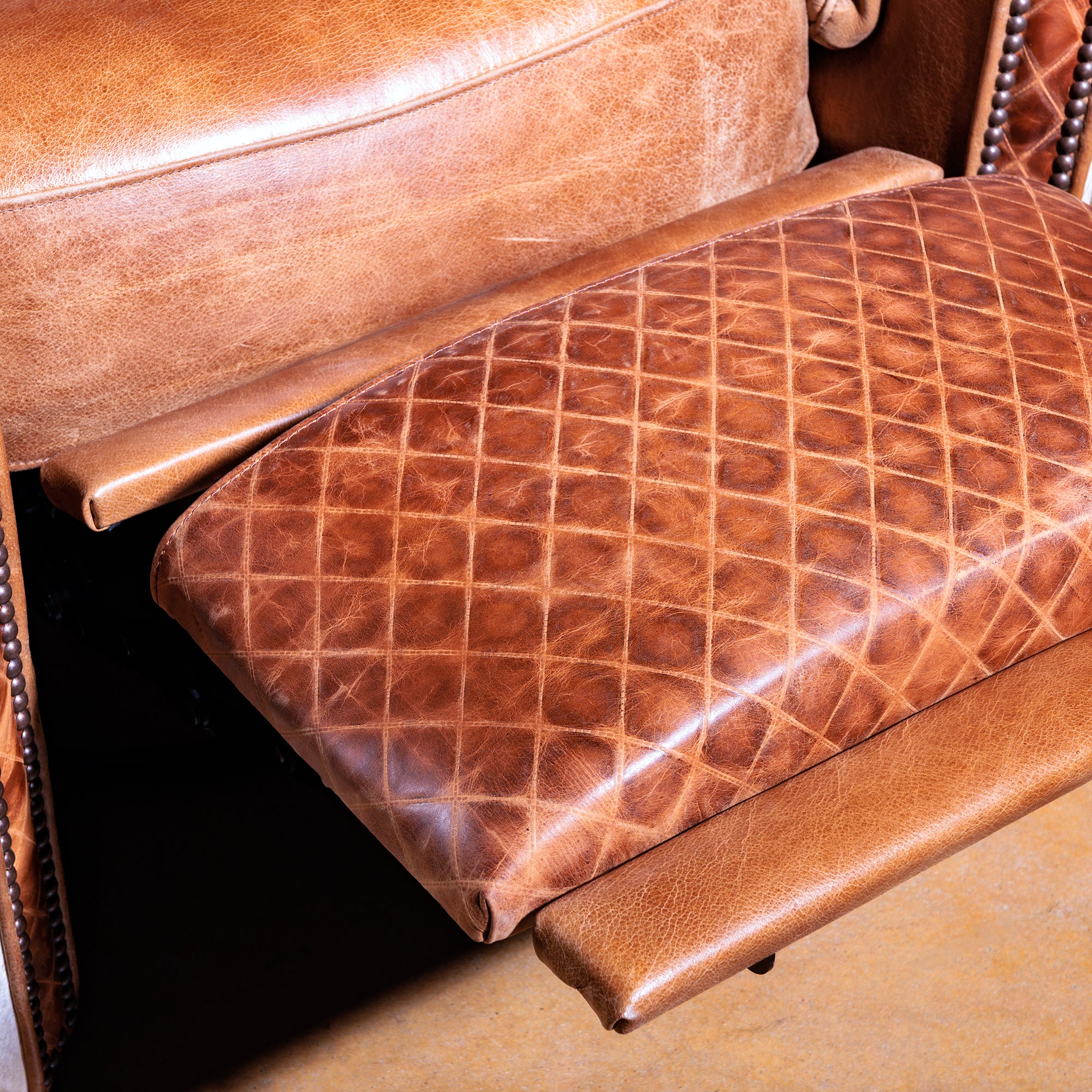 Seat and footrest detail on Western cowhide recliner