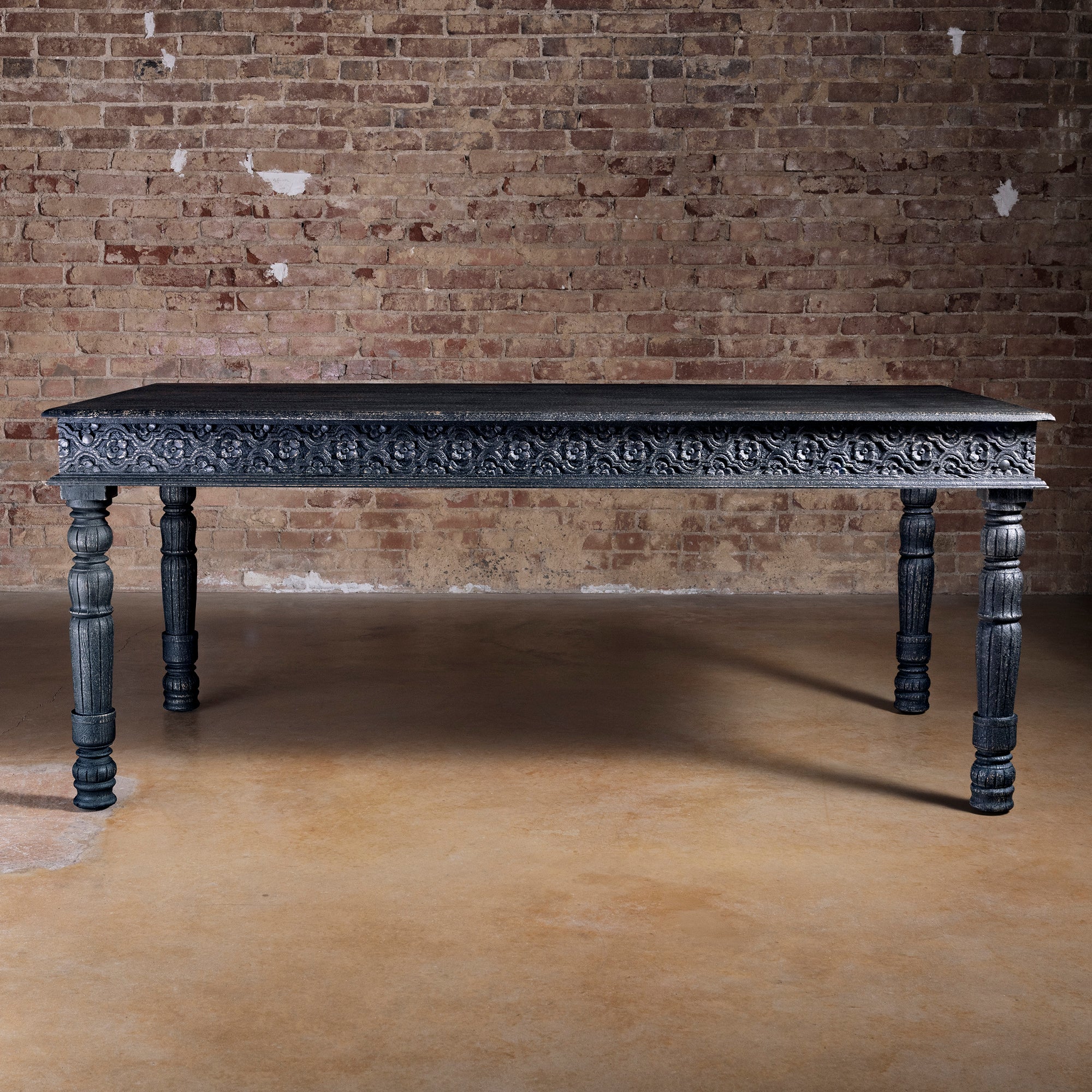 Fortville Carved Dining Table western hand carved dining table with long rectangular top, carved apron, and old-world turned legs