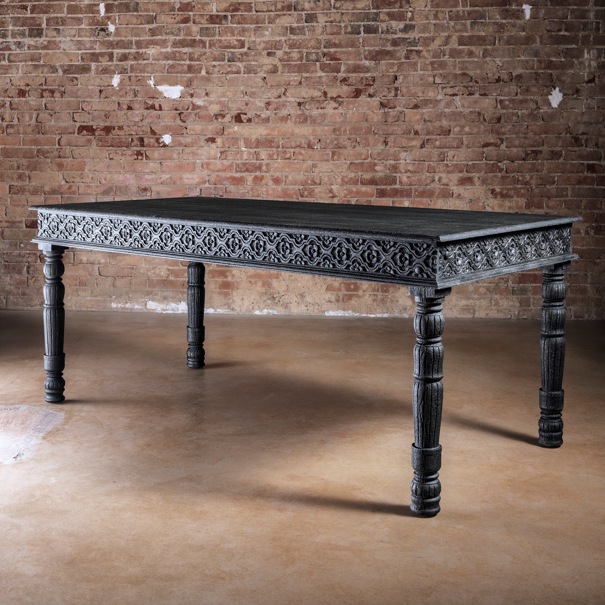 Fortville Carved Dining Table western hand carved dining table in black mango wood with ornate apron carving and turned legs