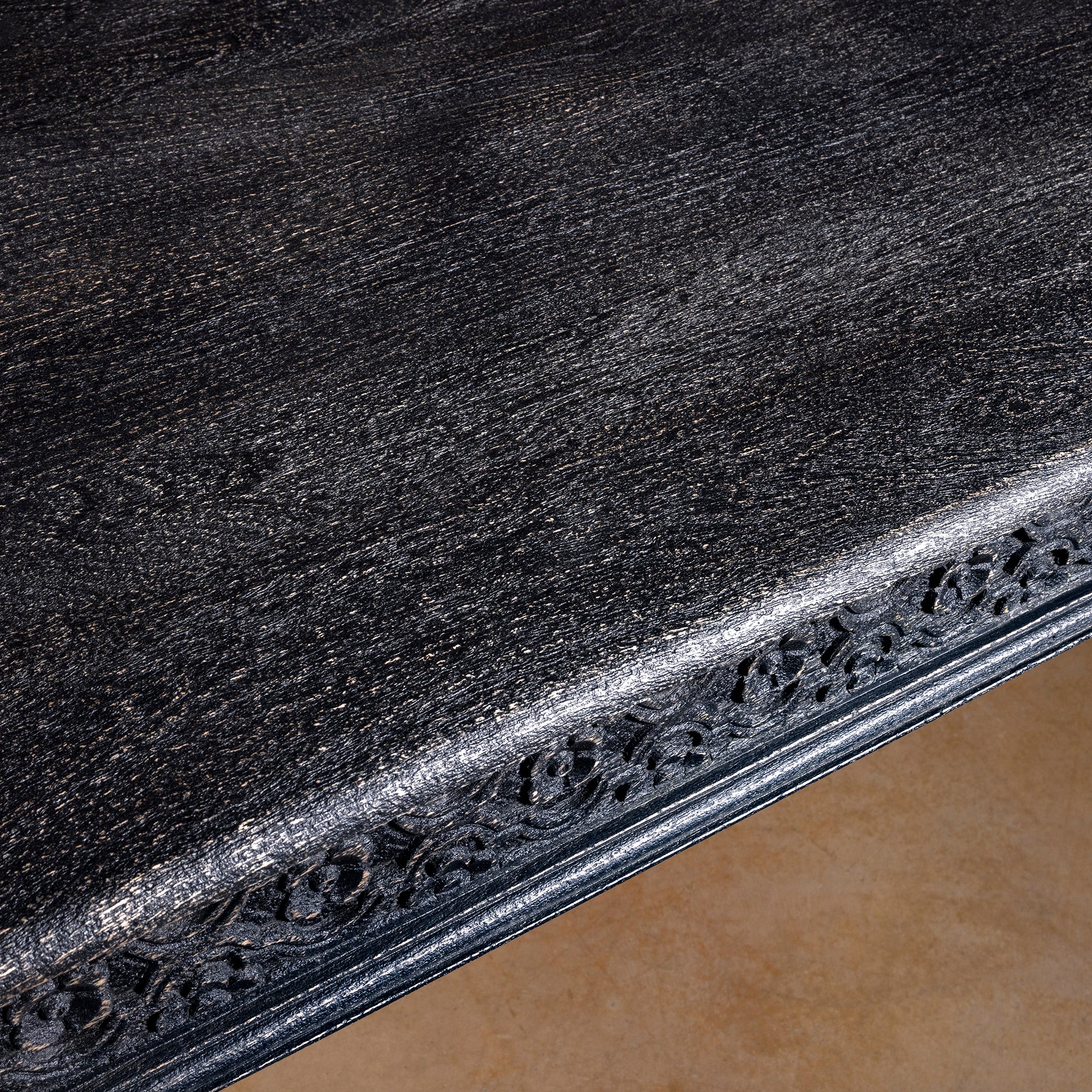 Fortville Carved Dining Table western hand carved dining table top detail with dark mango wood grain and softly worn heirloom finish