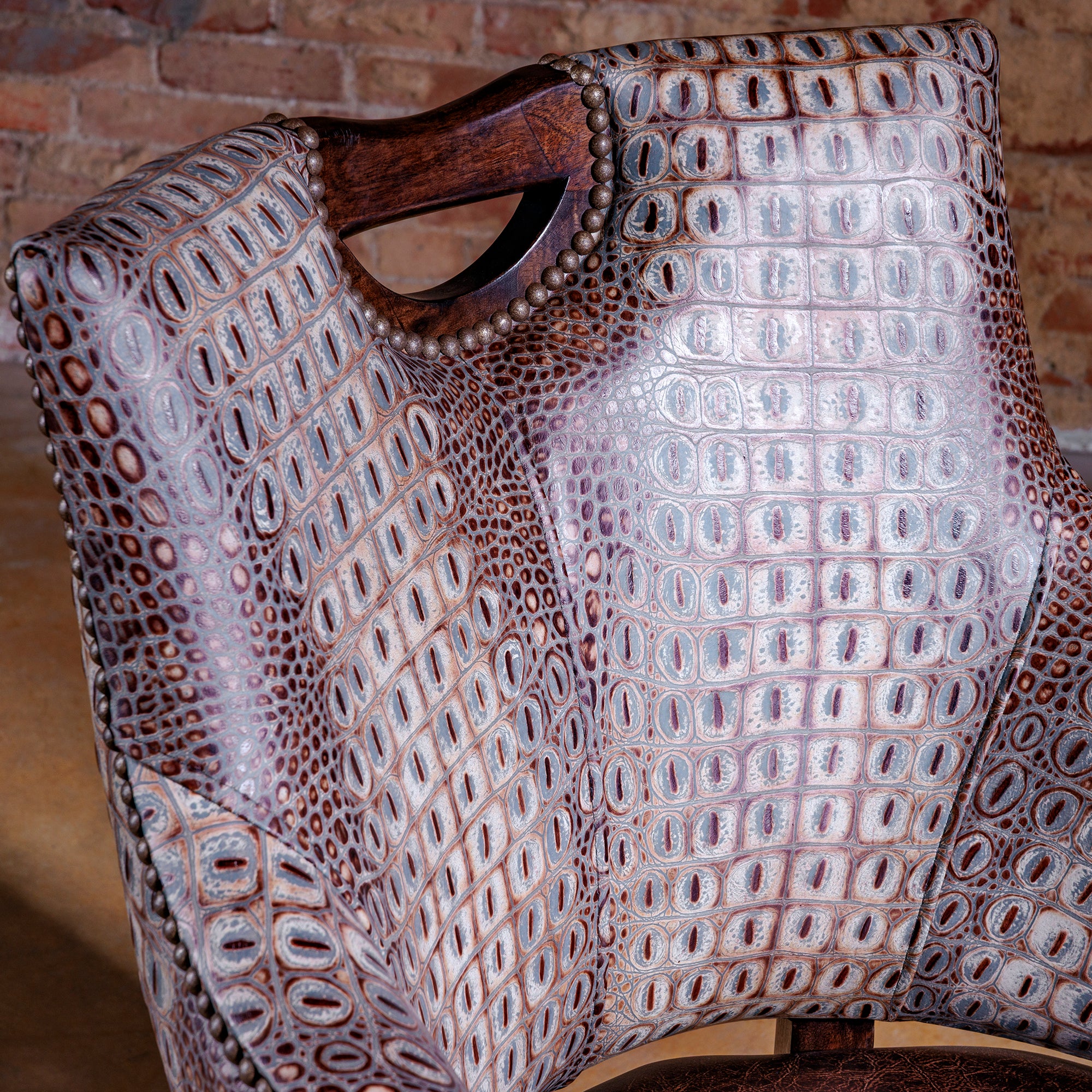 The Gambler’s Mark Western Poker Chair in embossed top-grain croc leather front detail