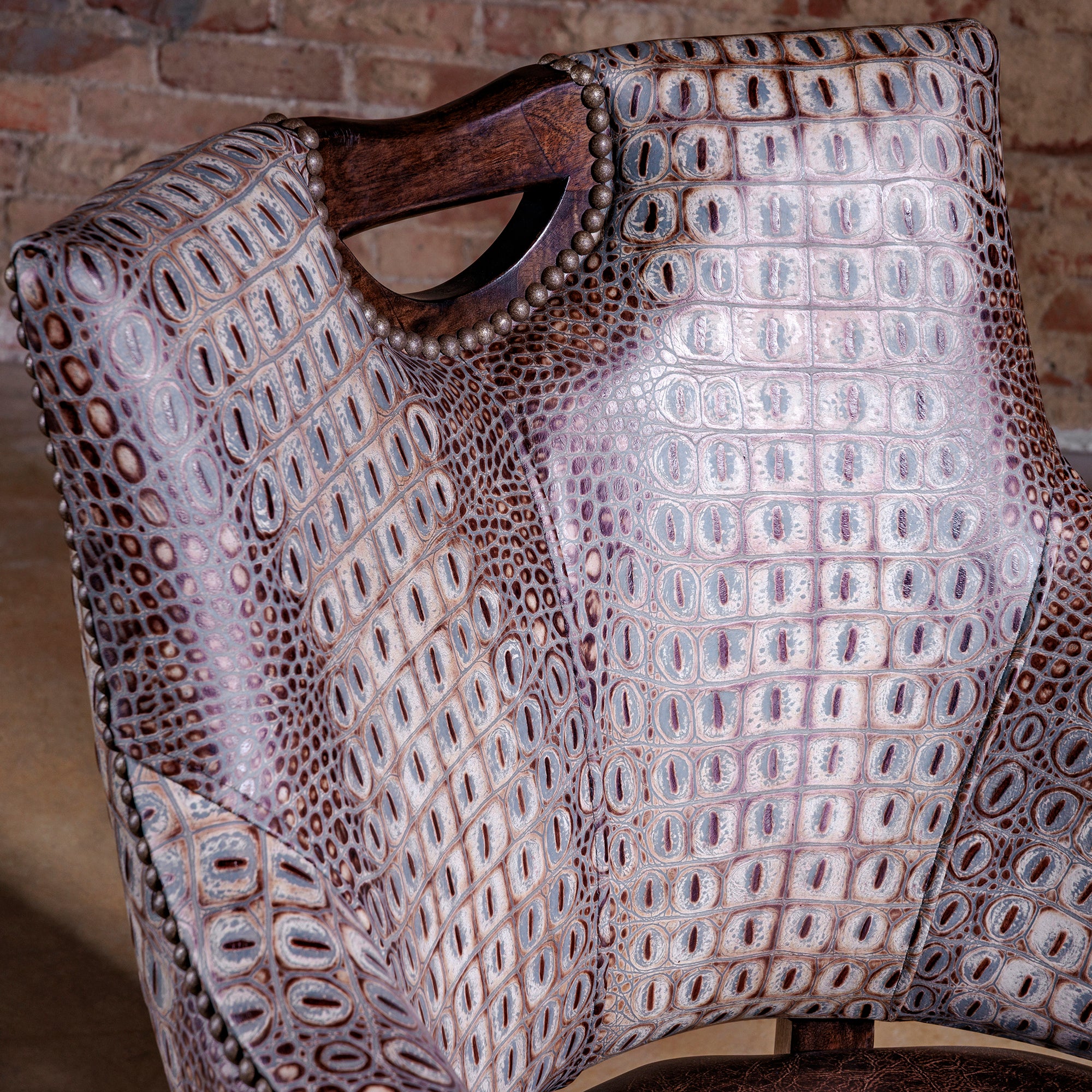 The Gambler’s Mark Western Poker Chair in embossed top-grain croc leather front detail