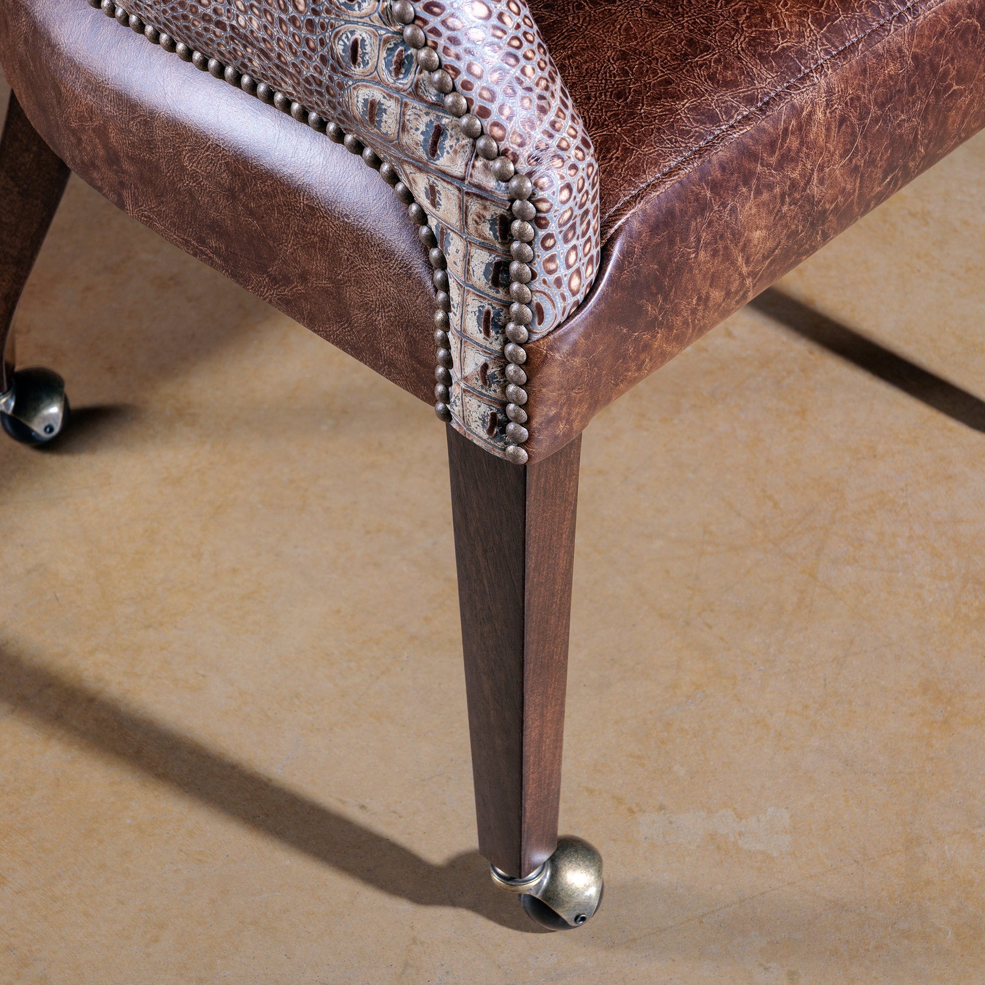 The Gambler’s Mark Western Poker Chair in embossed top-grain croc leather leg detail