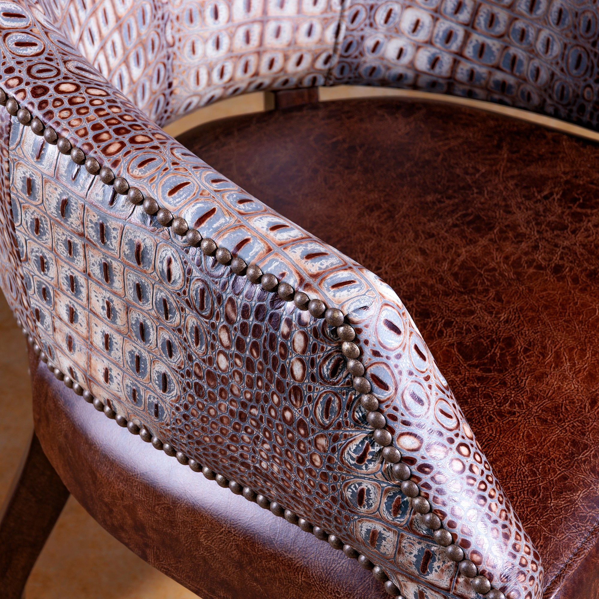 The Gambler’s Mark Western Poker Chair in embossed top-grain croc leather arm detail