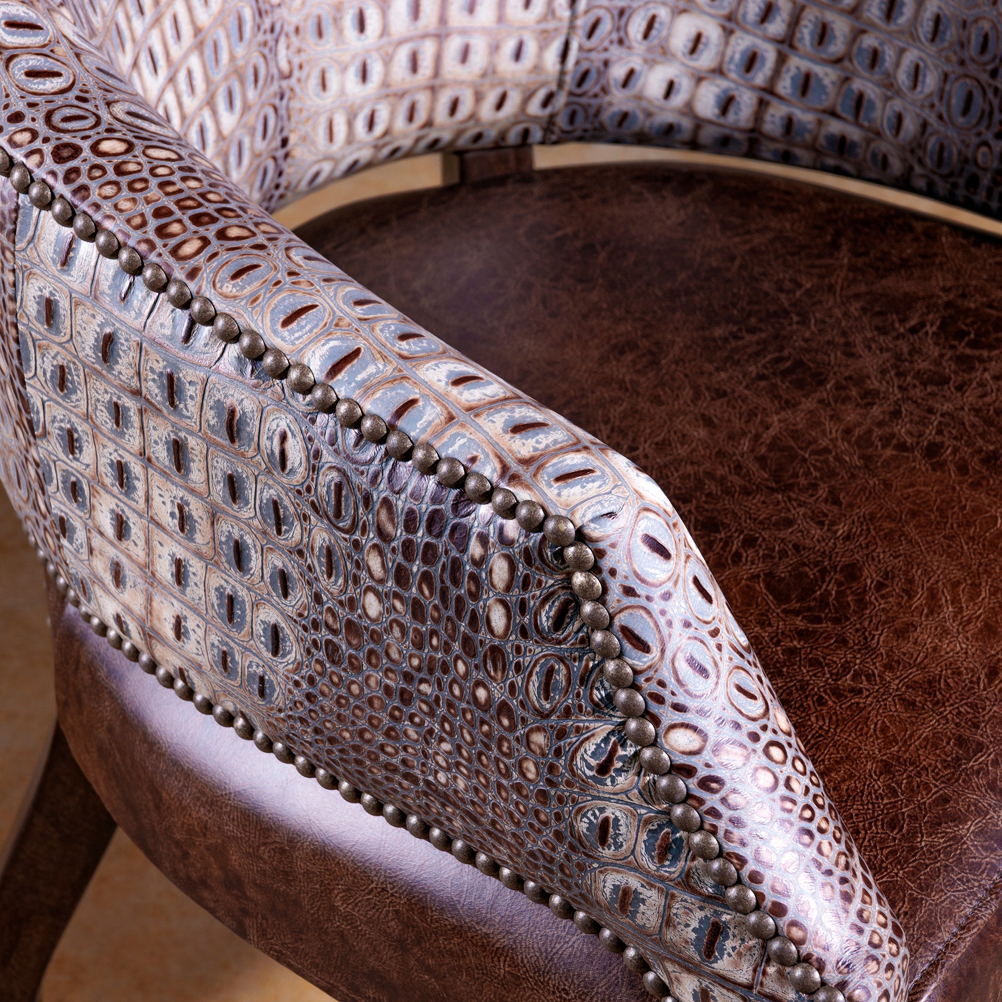 The Gambler’s Mark Western Poker Chair in embossed top-grain croc leather arm detail