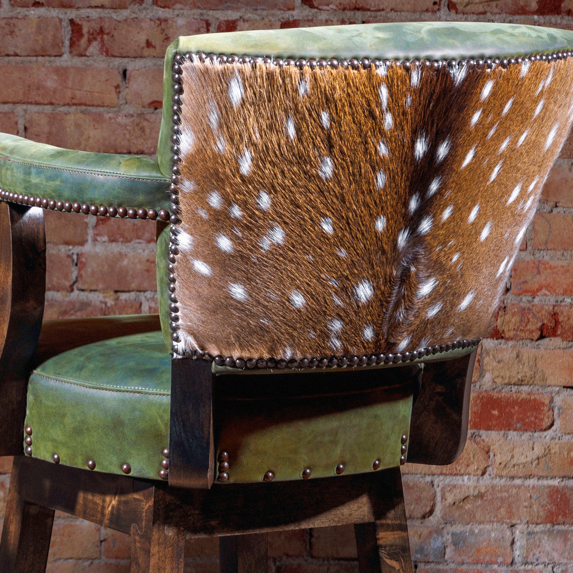 Back view showcasing axis deer hide panel on bar stool