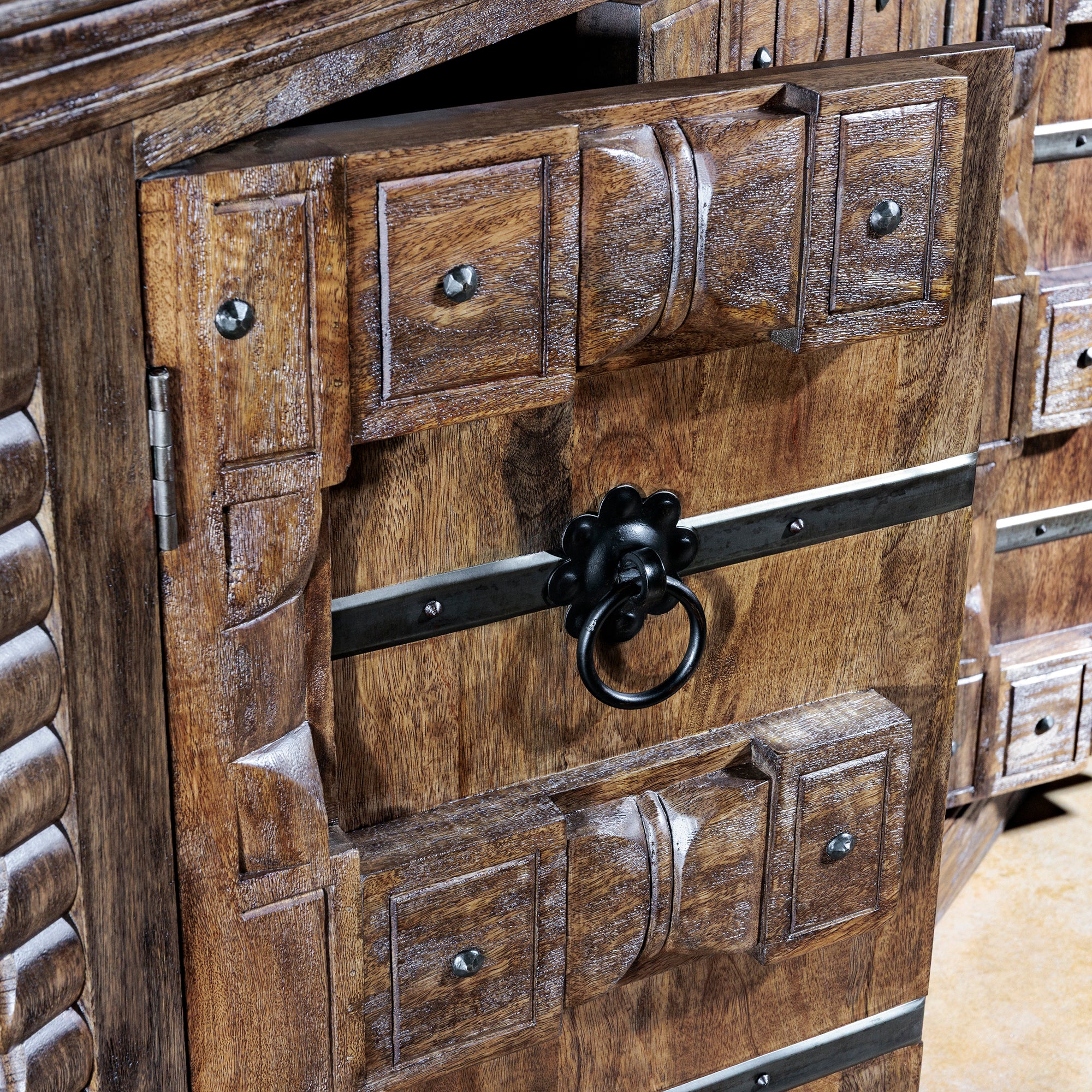 Spanish mission-style carved door detail with iron ring pull on the Hacienda Ironwood Buffet