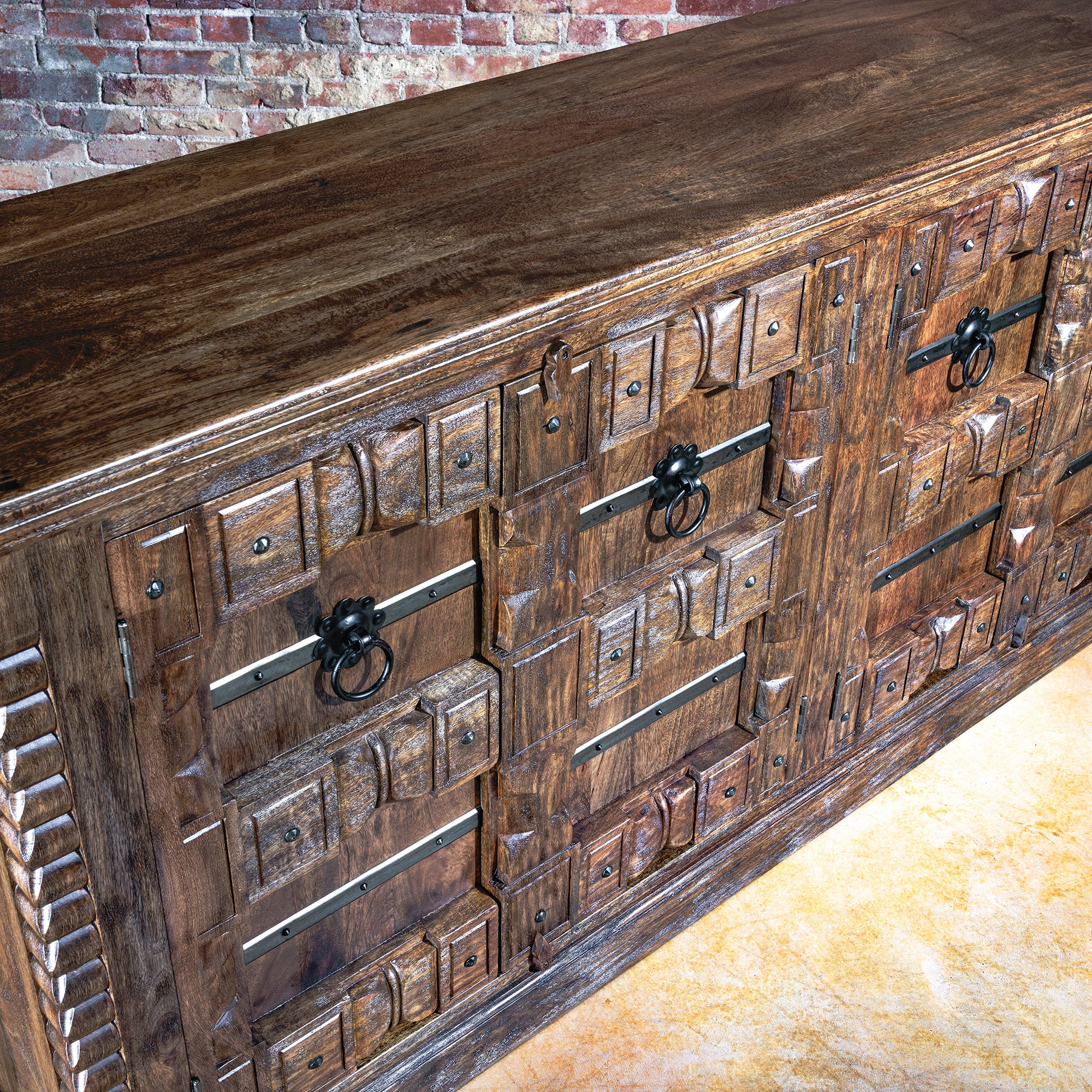 Angled view of large Western buffet with hand-carved drawers