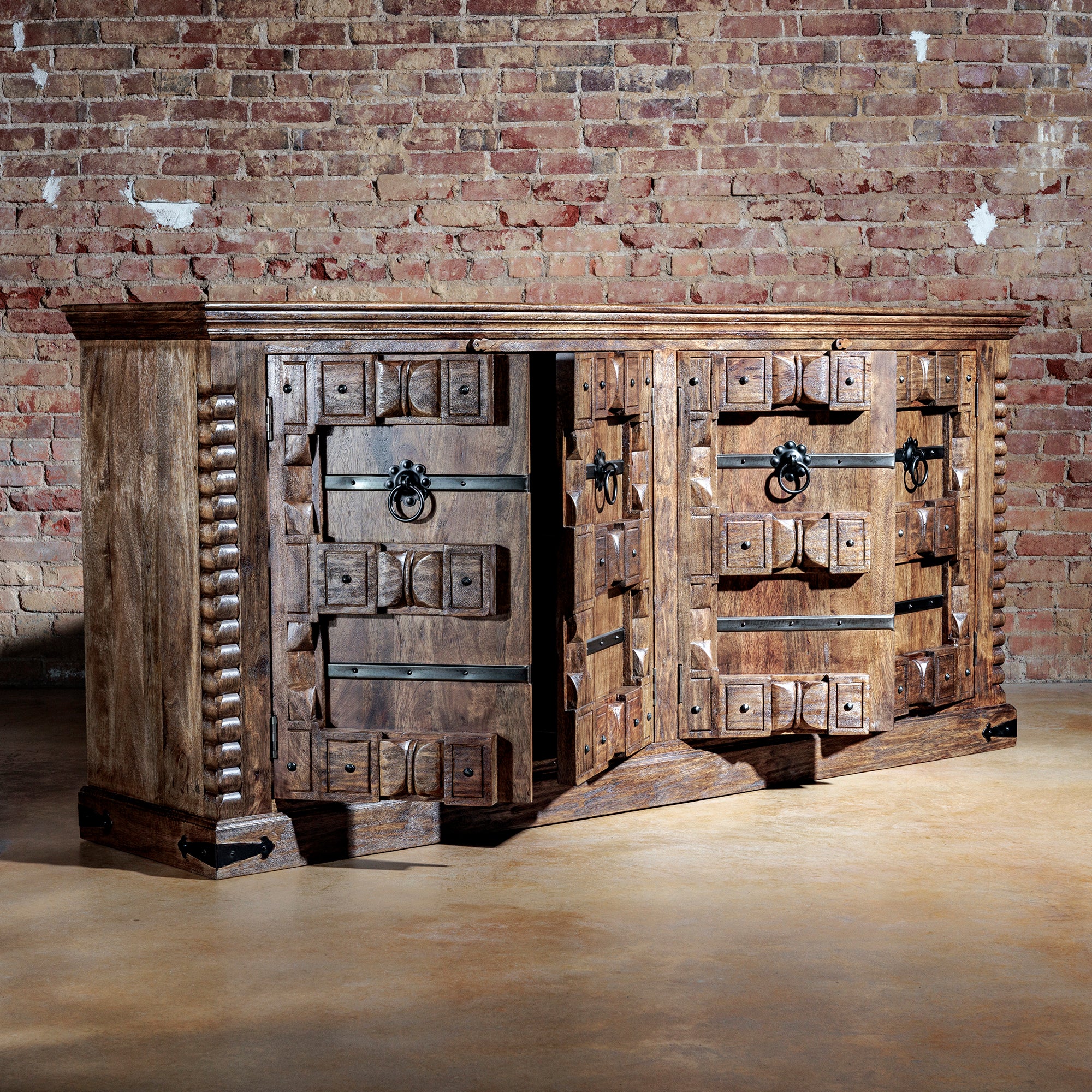 Hacienda Ironwood Buffet with carved doors open revealing spacious cabinet storage