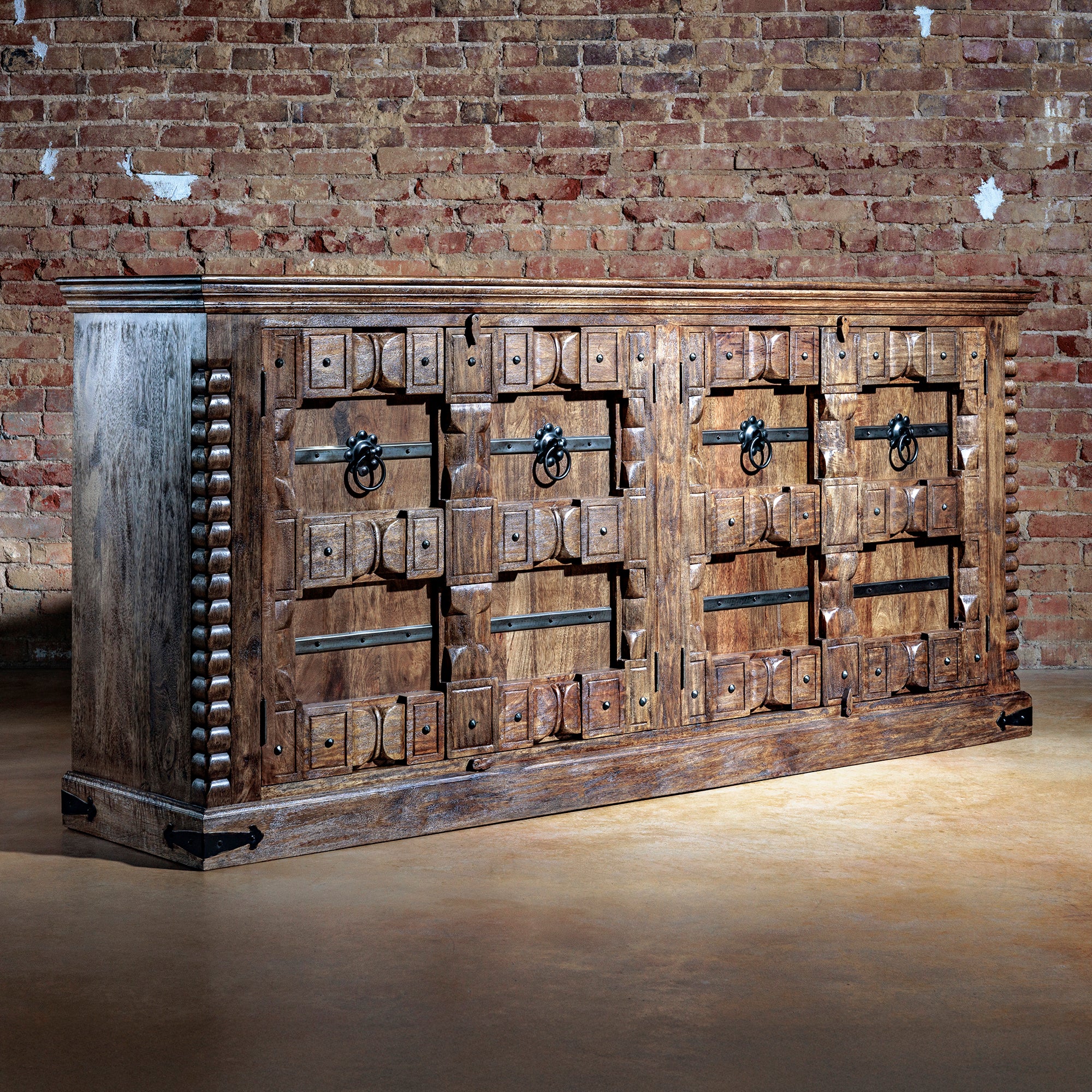 Angled view of the Hacienda Ironwood Buffet showcasing handcrafted wood and ornamental ironwork