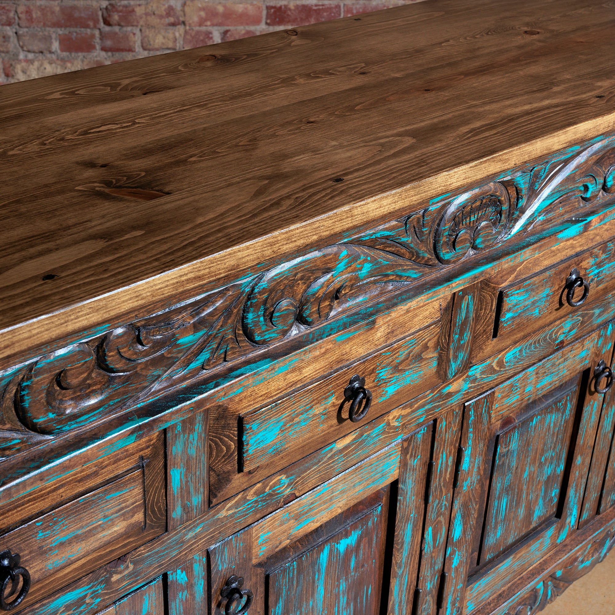 Solid wood top with detailed carving on Western-style console