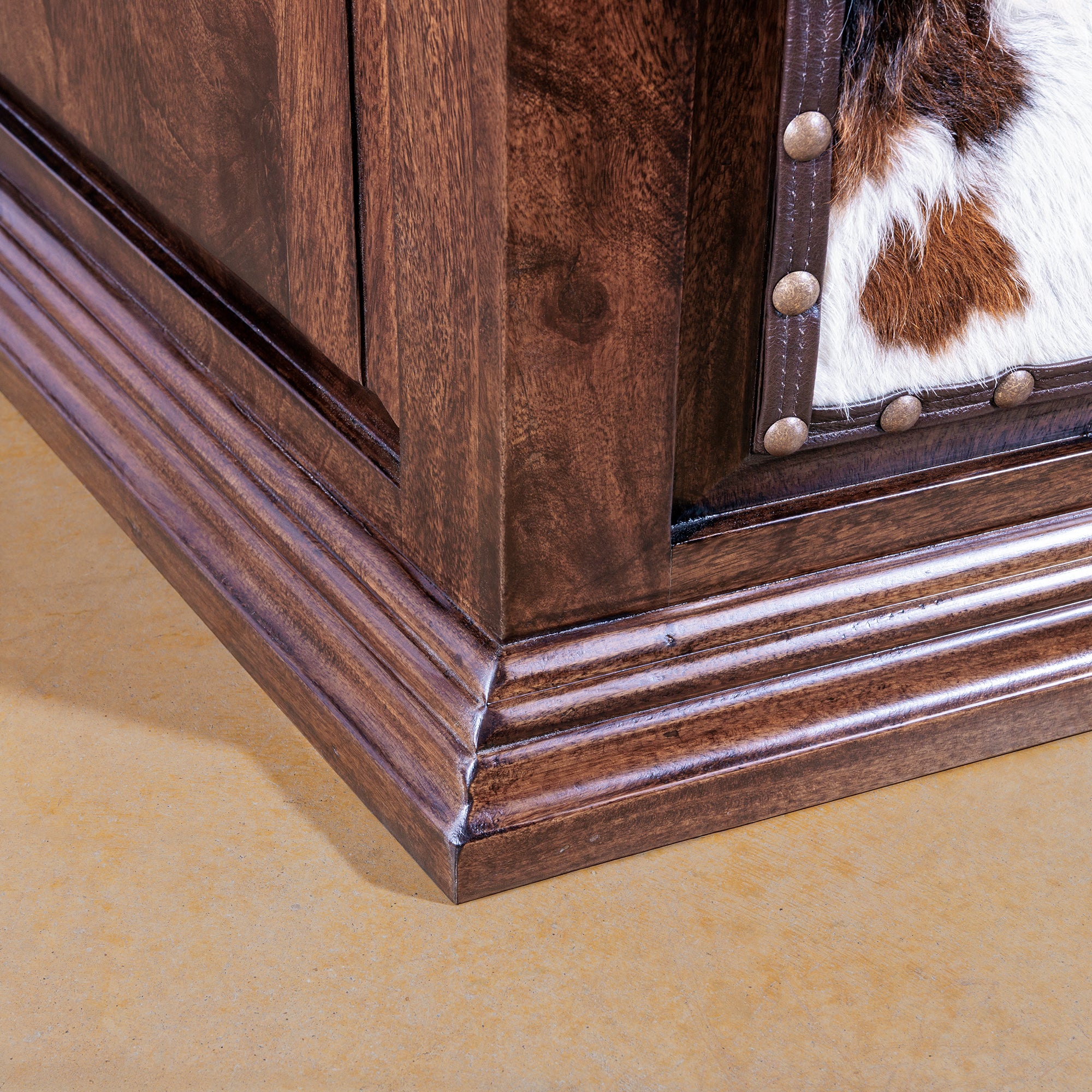 Close-up of wood base and trim on High Plains executive desk