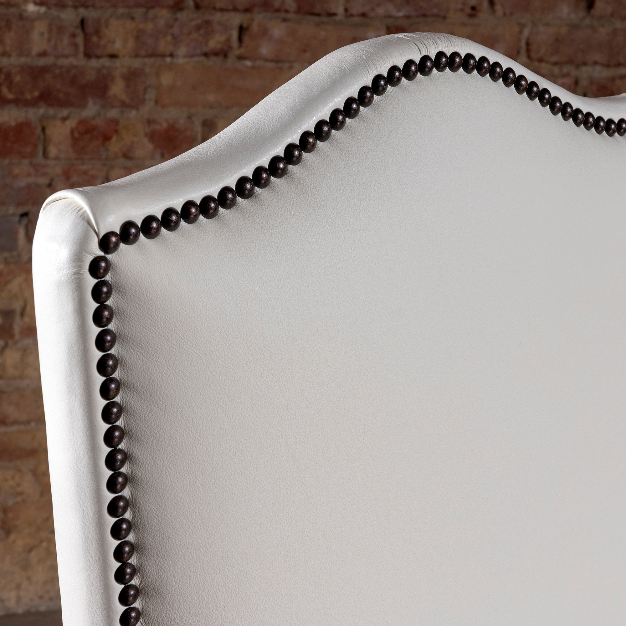 Front view closeup of High Plains Ivory white leather seat and tall back dining chair