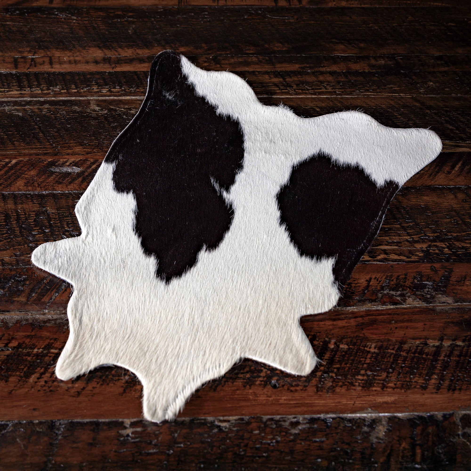 Genuine cowhide placemat from Into The West — handcrafted Western table décor and gift under $100.
