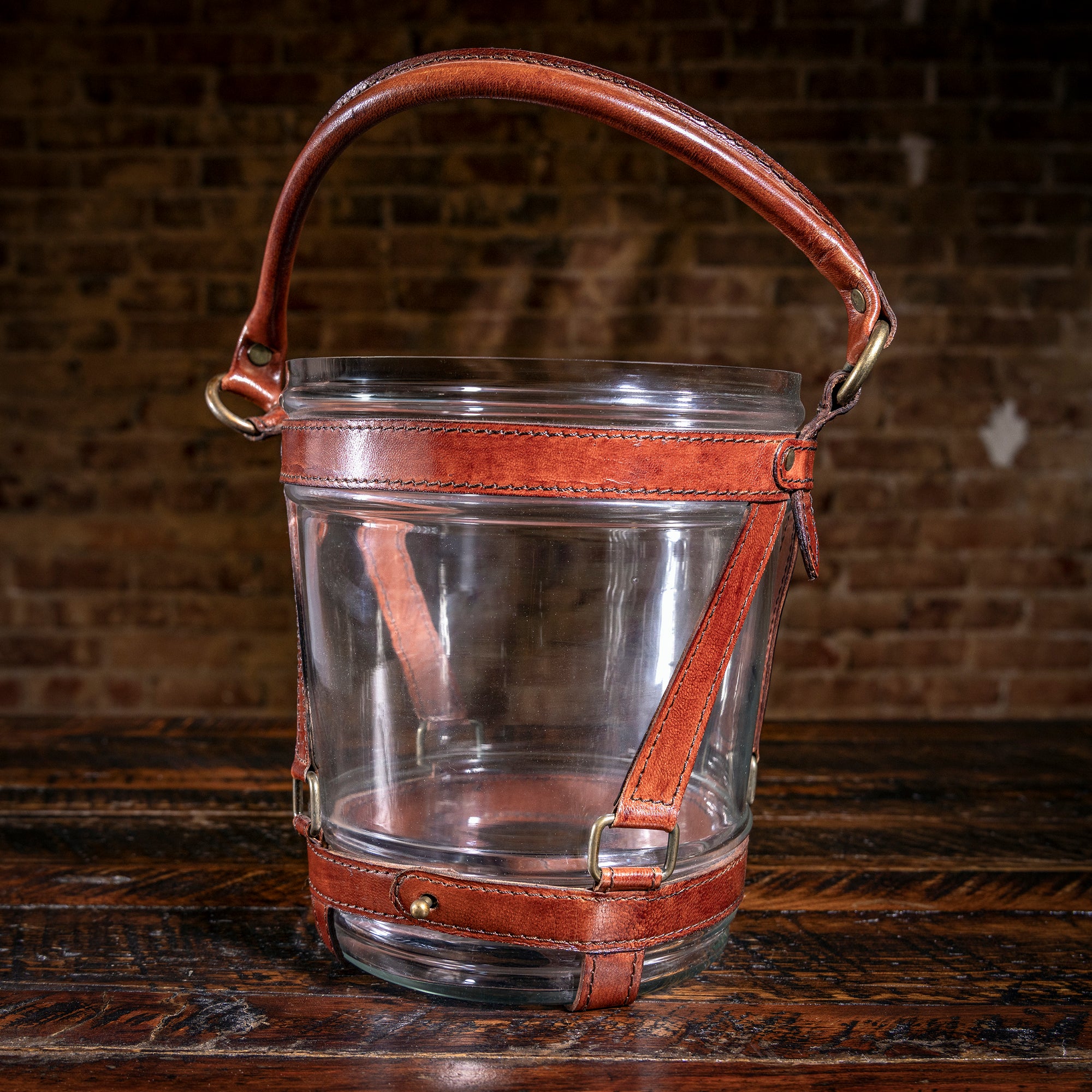 Leather and glass champagne bucket with brass hardware — Western luxury hostess gift idea.