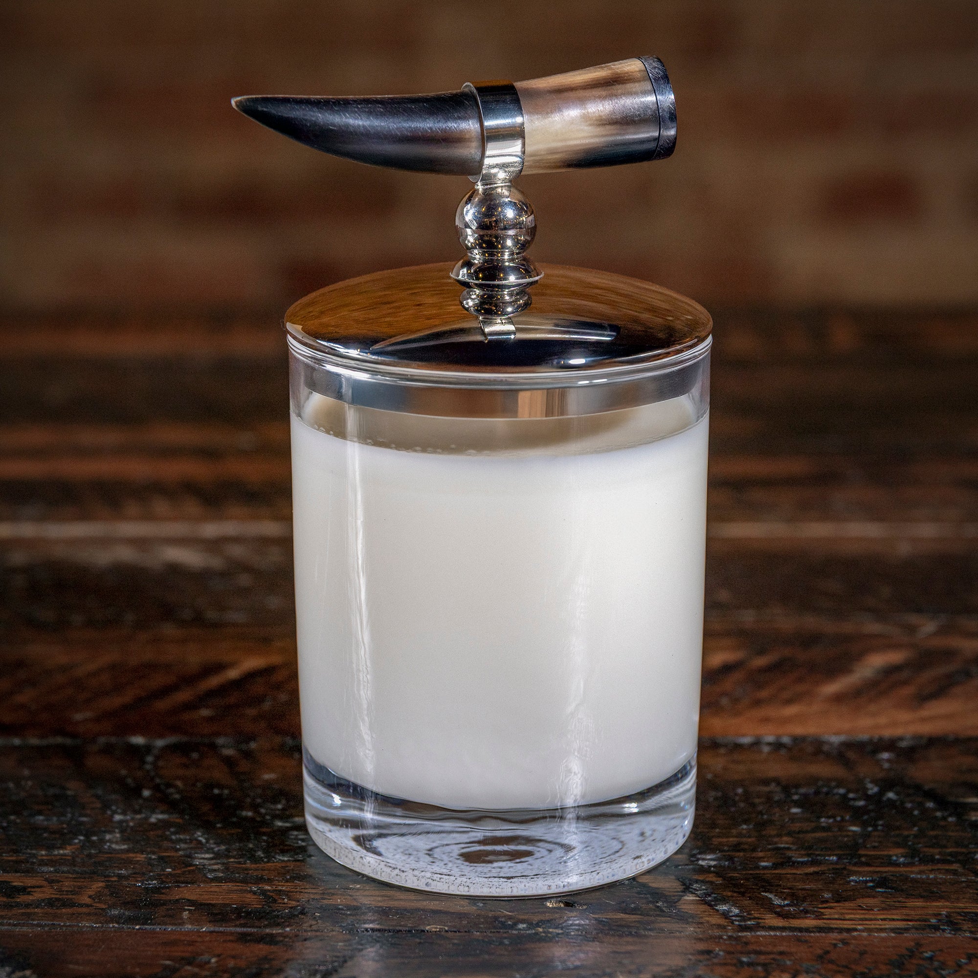 Hand-poured Western candle with bullhorn detail — rustic luxury accent for cowboy-inspired homes.