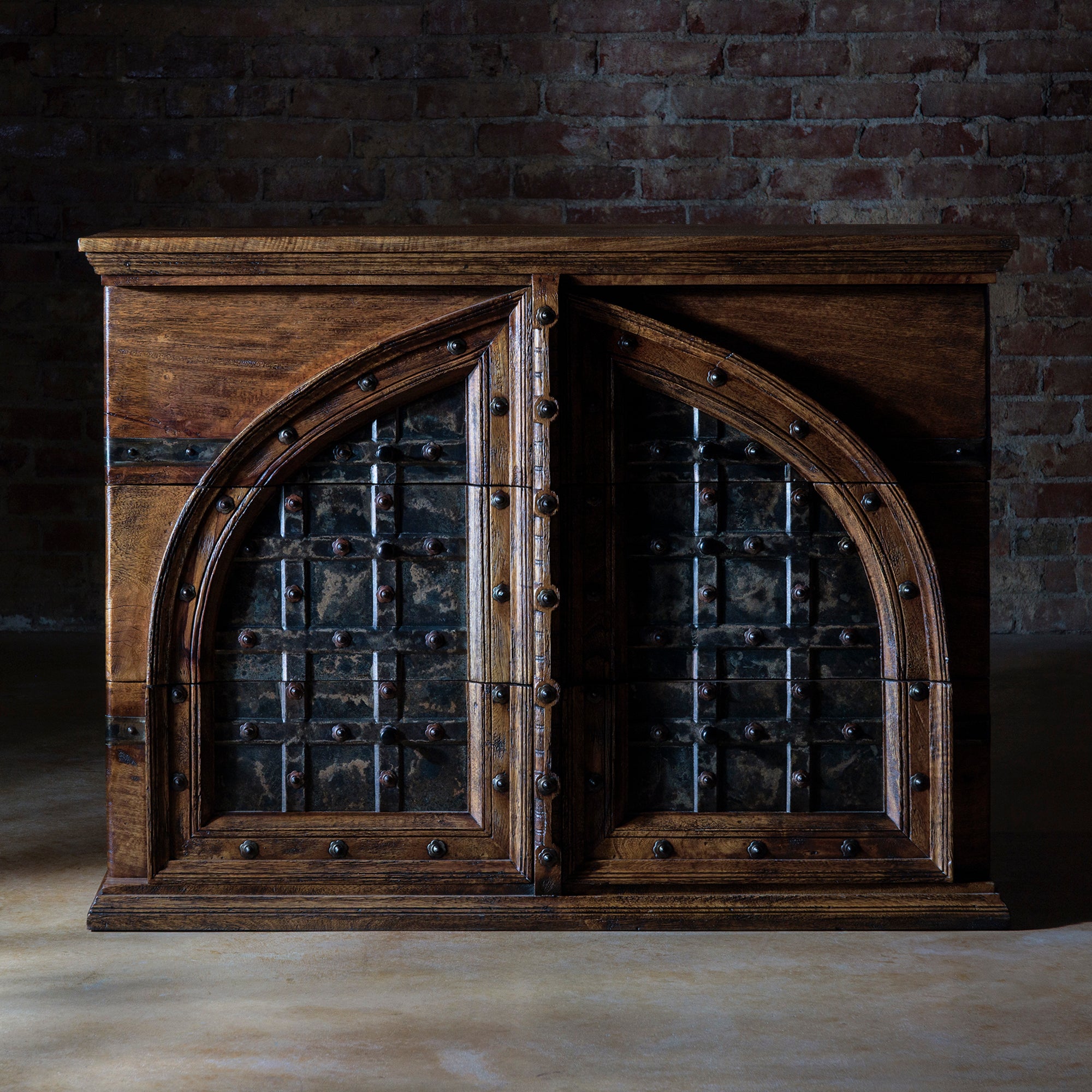 Hero view of the Cathedral Range Nightstand showing mango wood and iron arch design