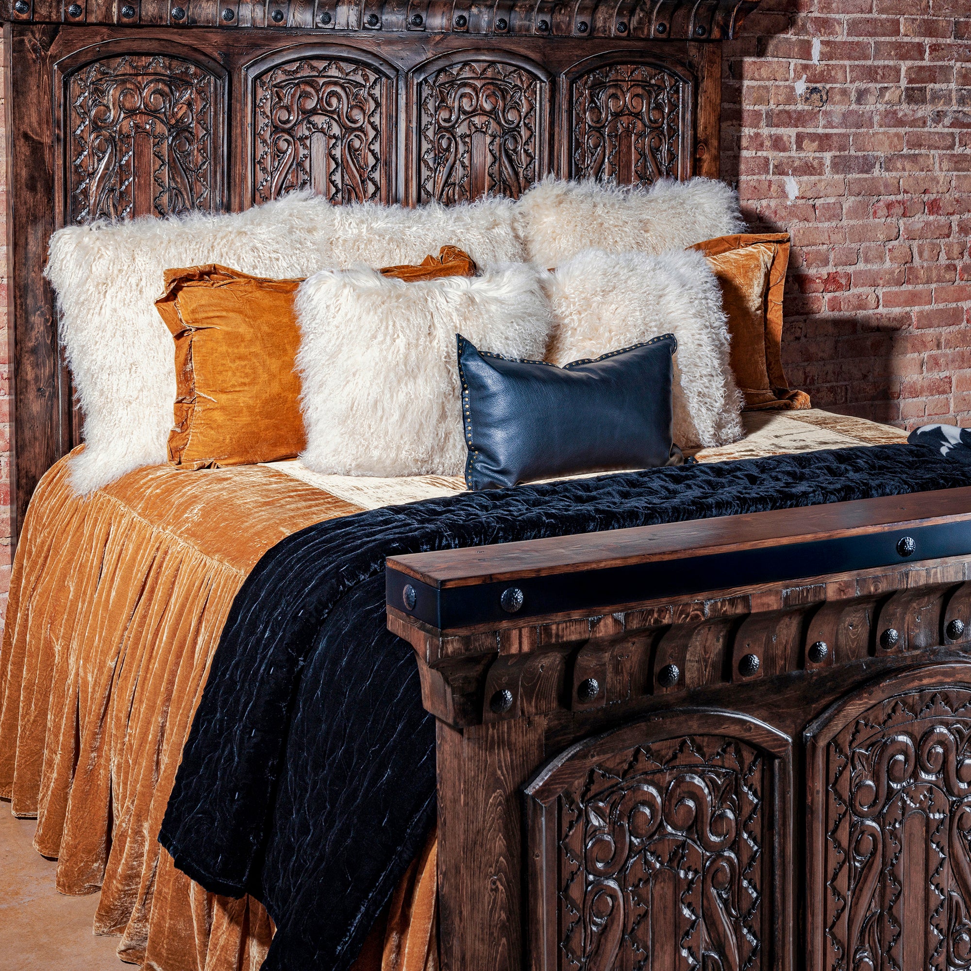 Close-up of hand-carved headboard with iron banding on Ironwood Carved Bed