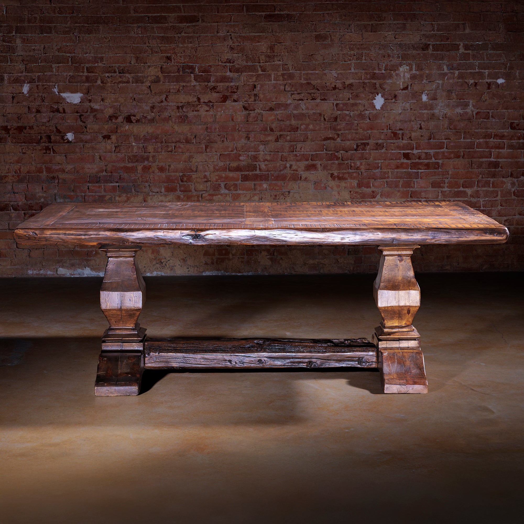 Reclaimed hardwood dining table with rustic character and artisan distressing.