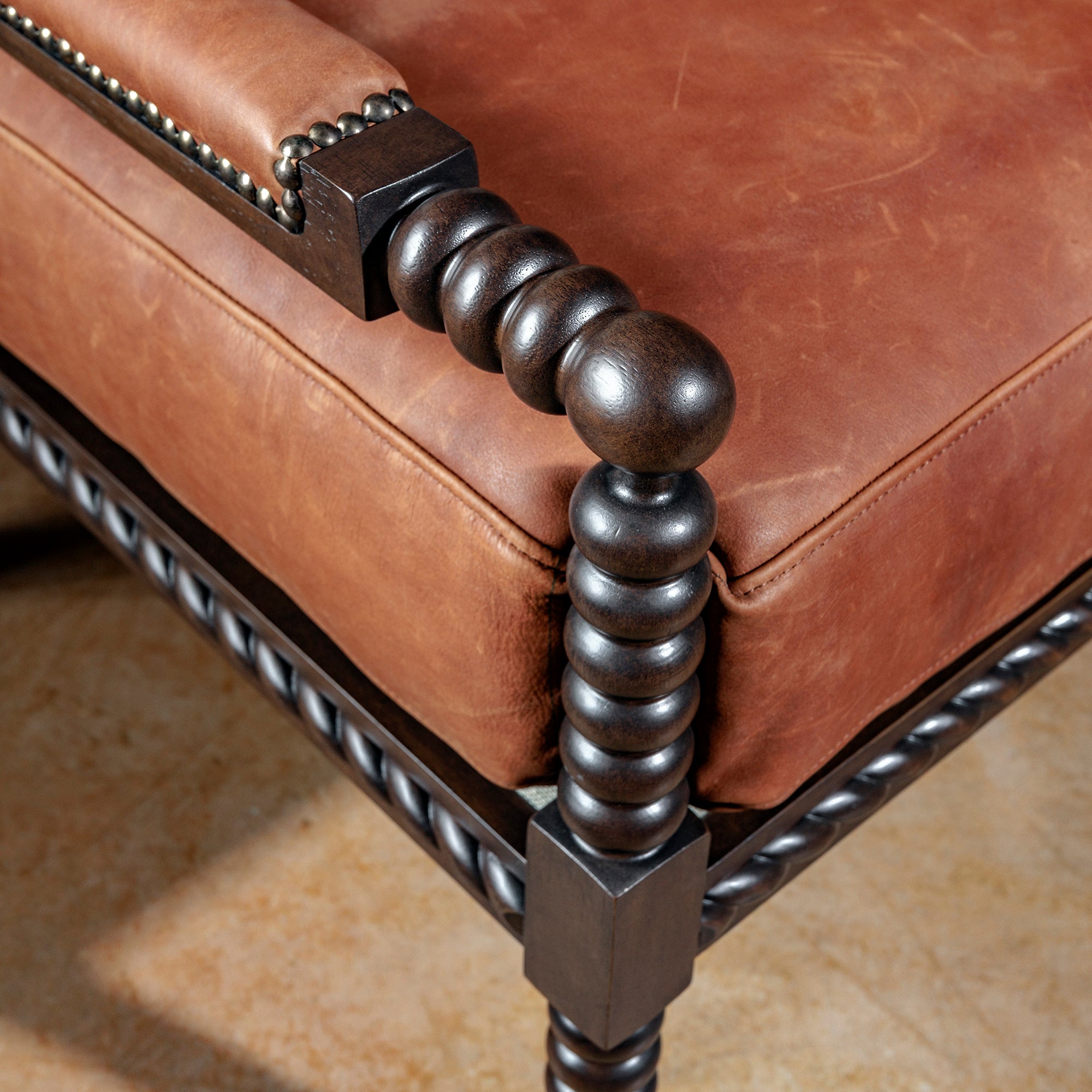 western-leather-seat-armrest-nailhead-detail