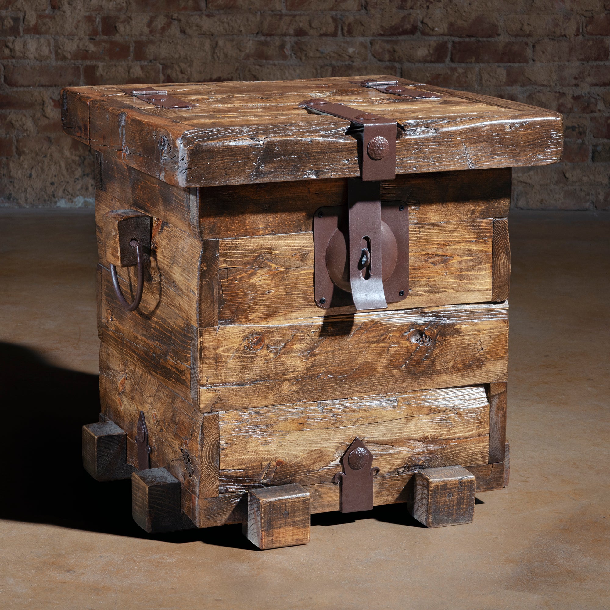 Small reclaimed wood trunk accent table with iron strap hinges and latch hardware