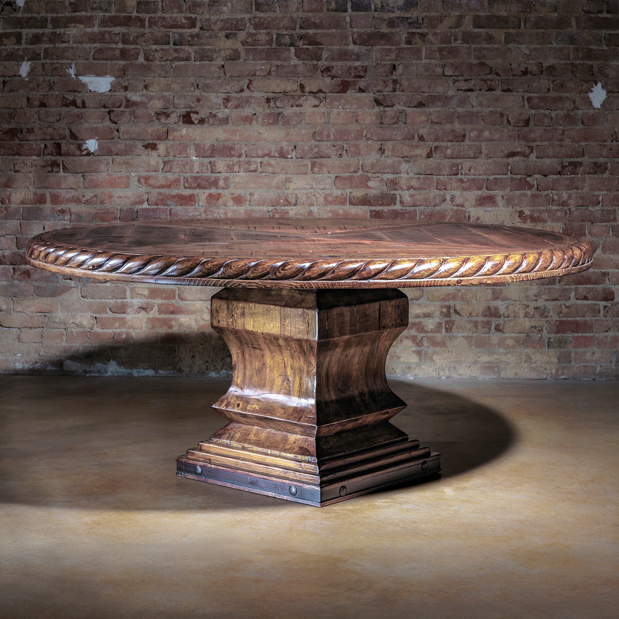 Western-style reclaimed wood dining table in rustic interior setting