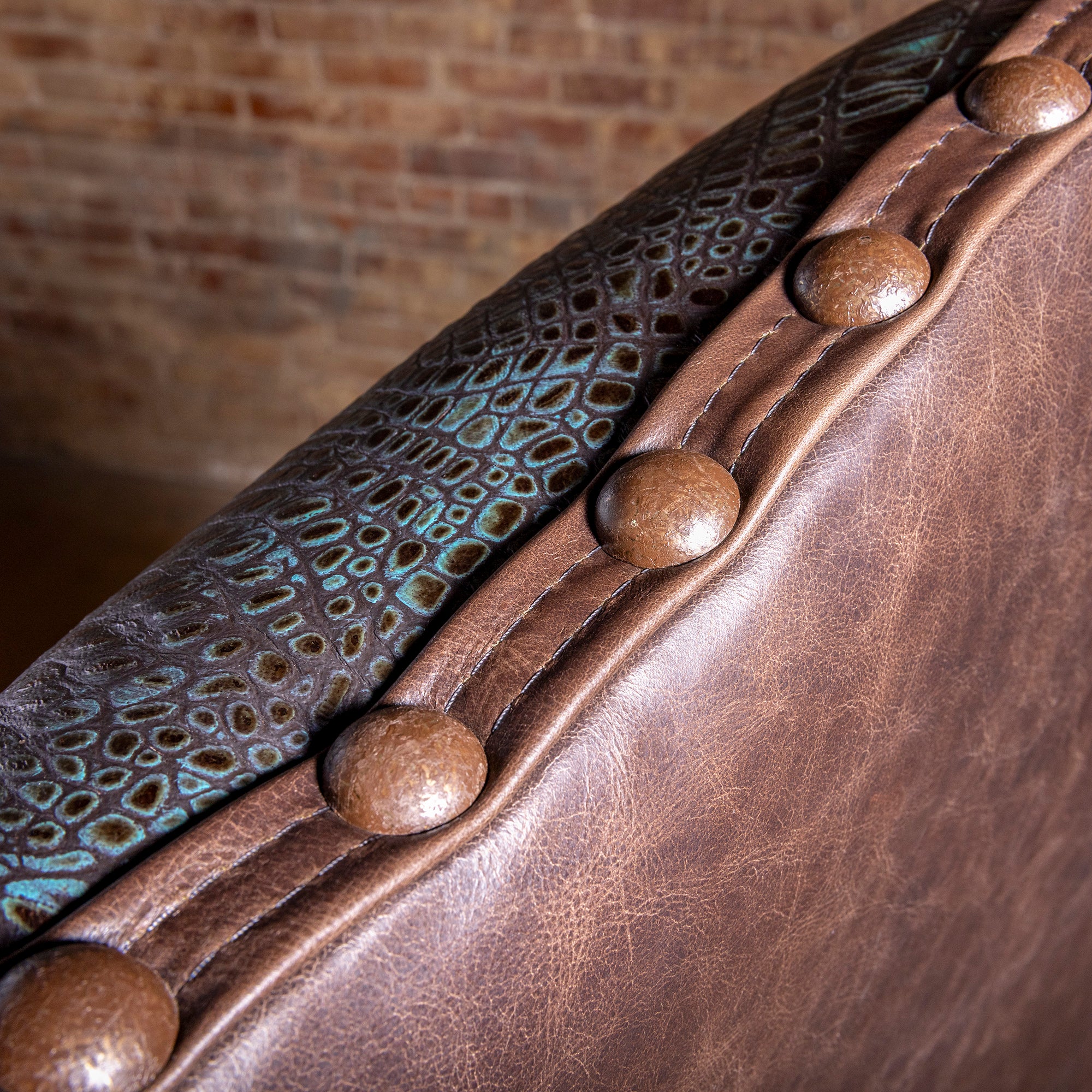 Nailhead and concho-style accent detail on Western leather executive desk chair with croc-embossed trim