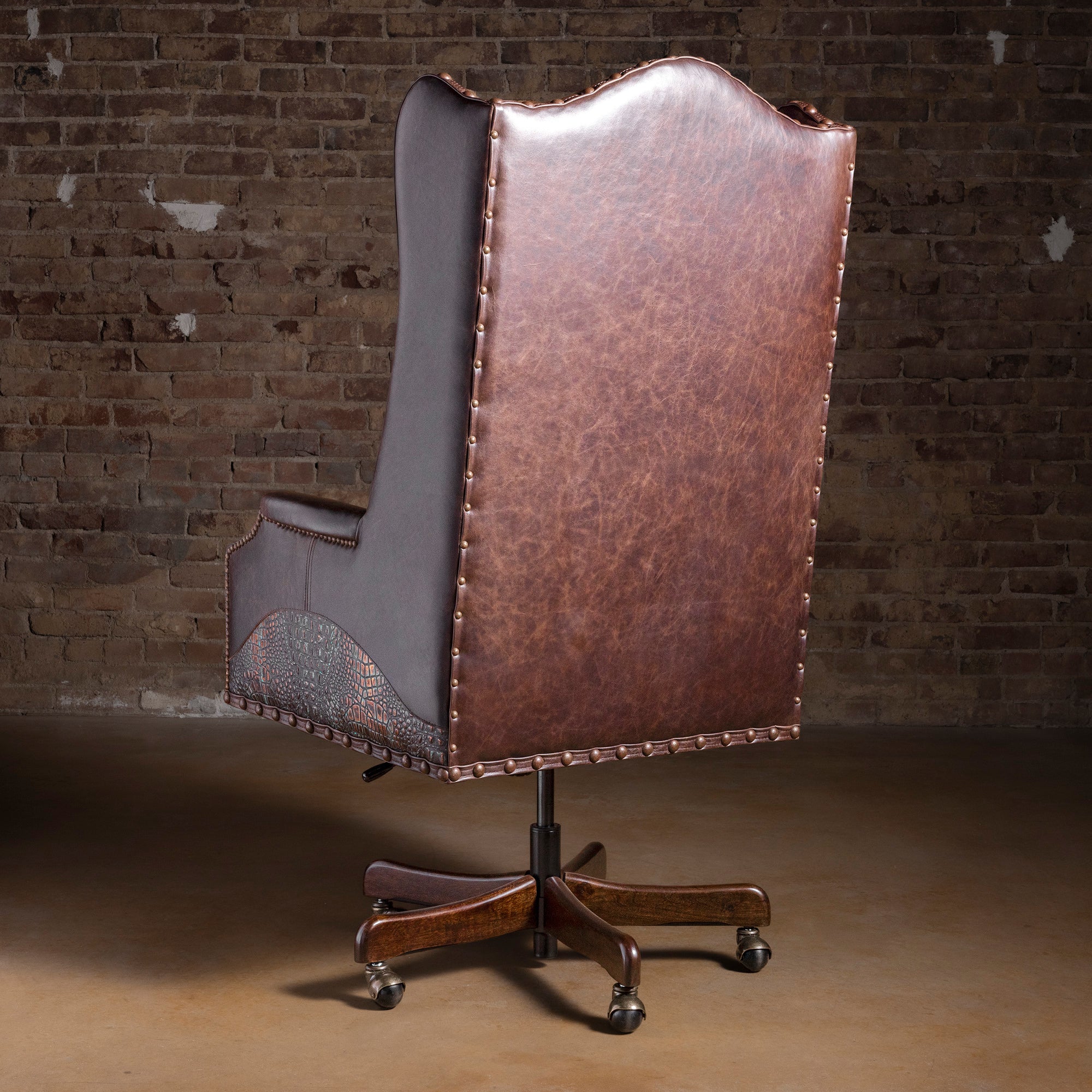 Back view of high-back Western leather desk chair with nailhead trim and croc-embossed lower panel accents