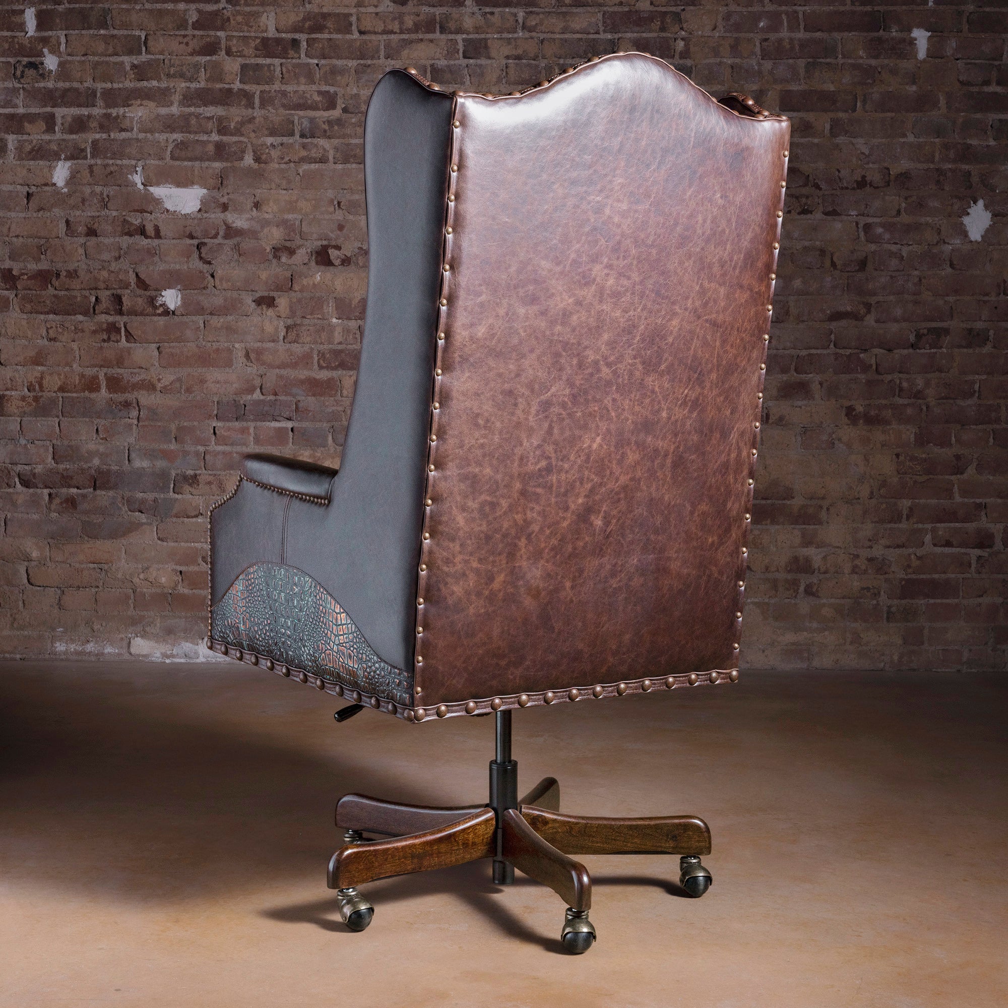 Back view of high-back Western leather desk chair with nailhead trim and croc-embossed lower panel accents