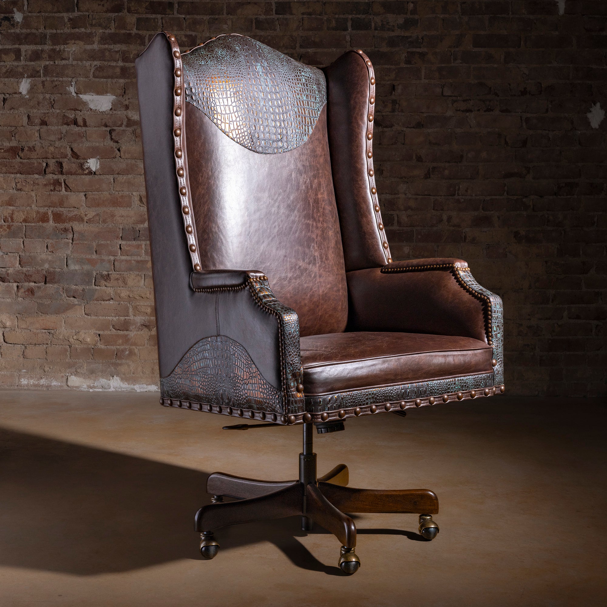 High-back Western leather executive desk chair with turquoise copper croc accents, nailhead trim, and rolling swivel base