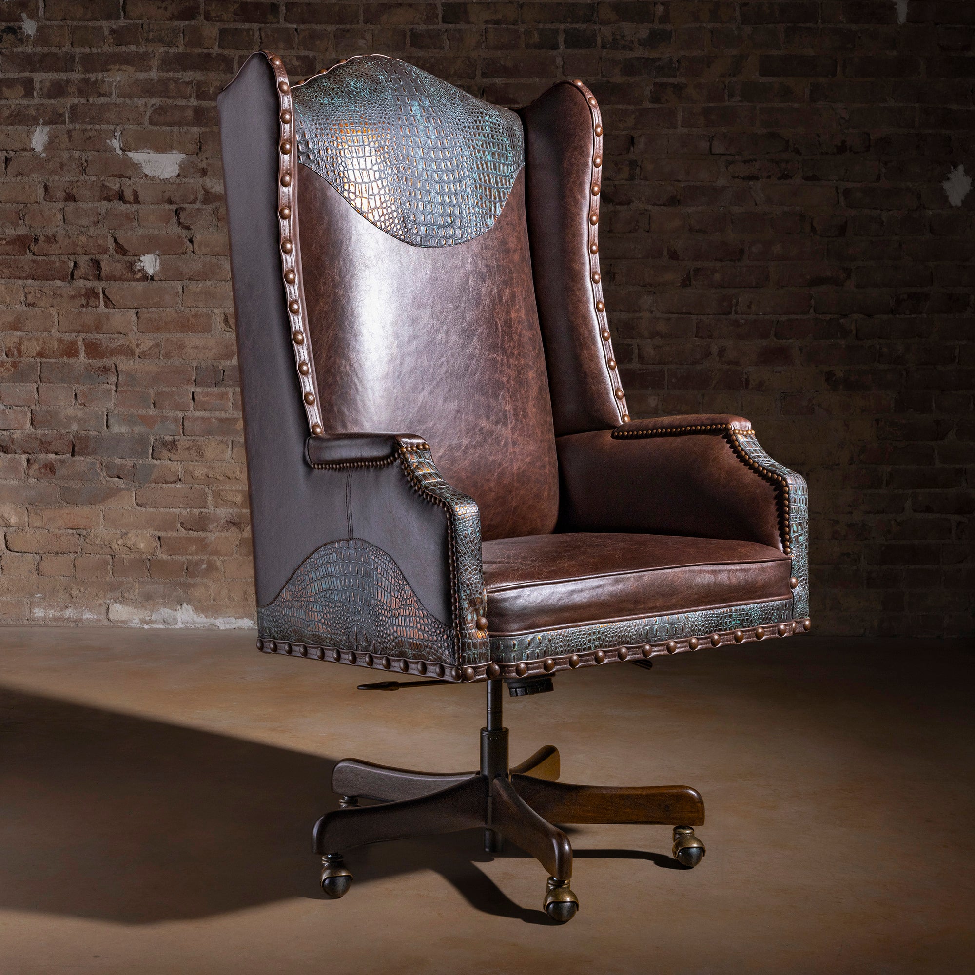 High-back Western leather executive desk chair with turquoise copper croc accents, nailhead trim, and rolling swivel base