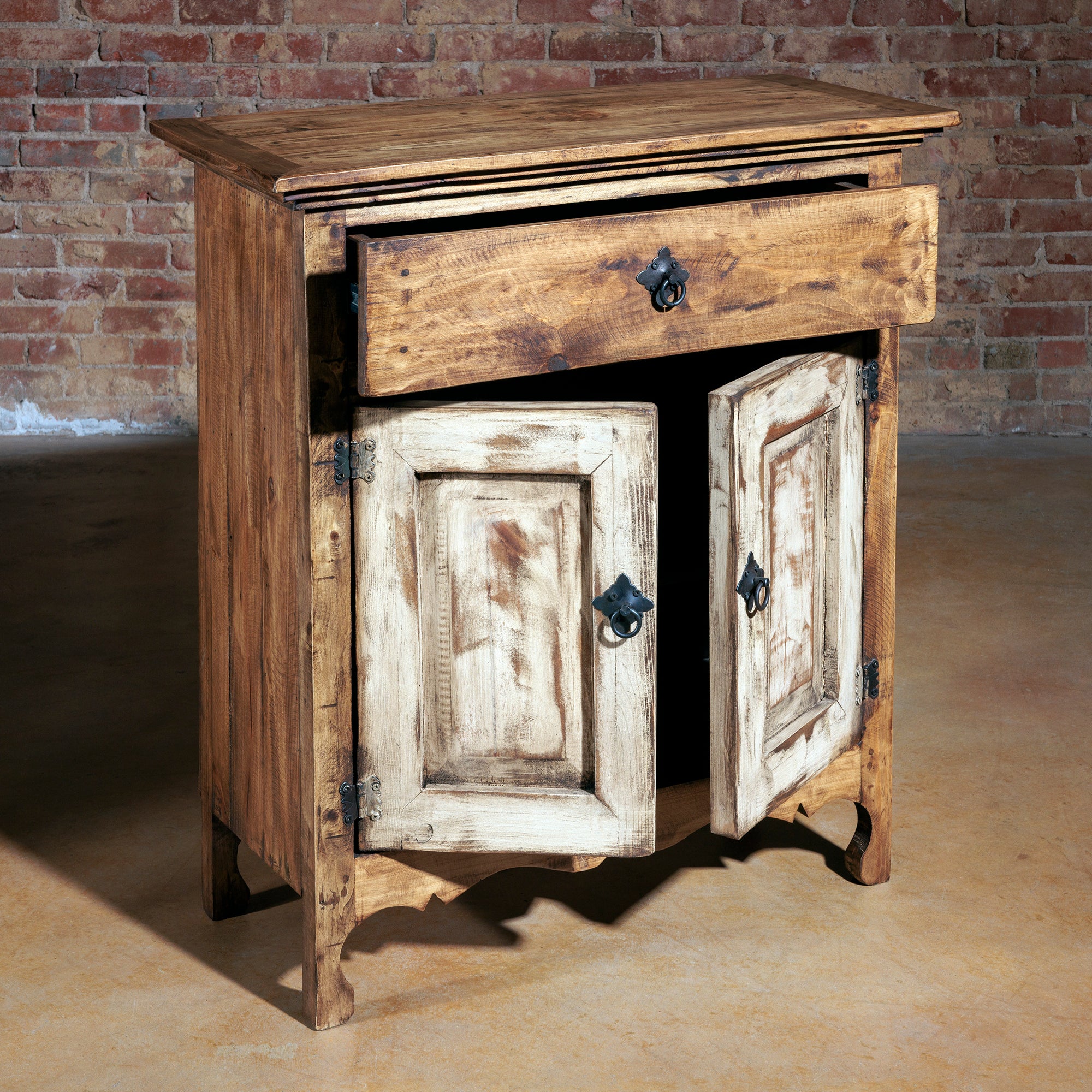 Angle view of rustic console with drawer and open cabinet doors