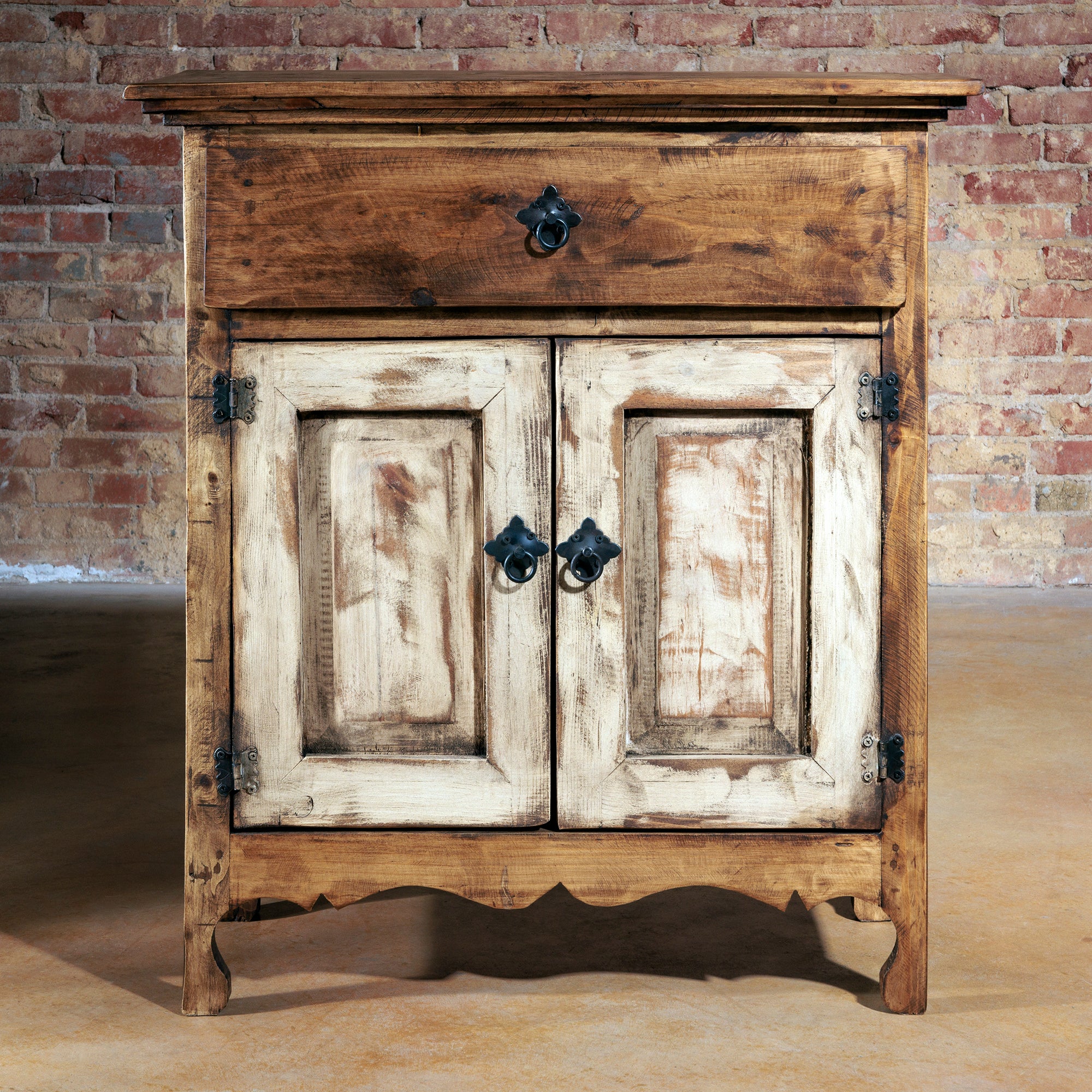 Small rustic wood console with whitewashed doors and iron ring pulls
