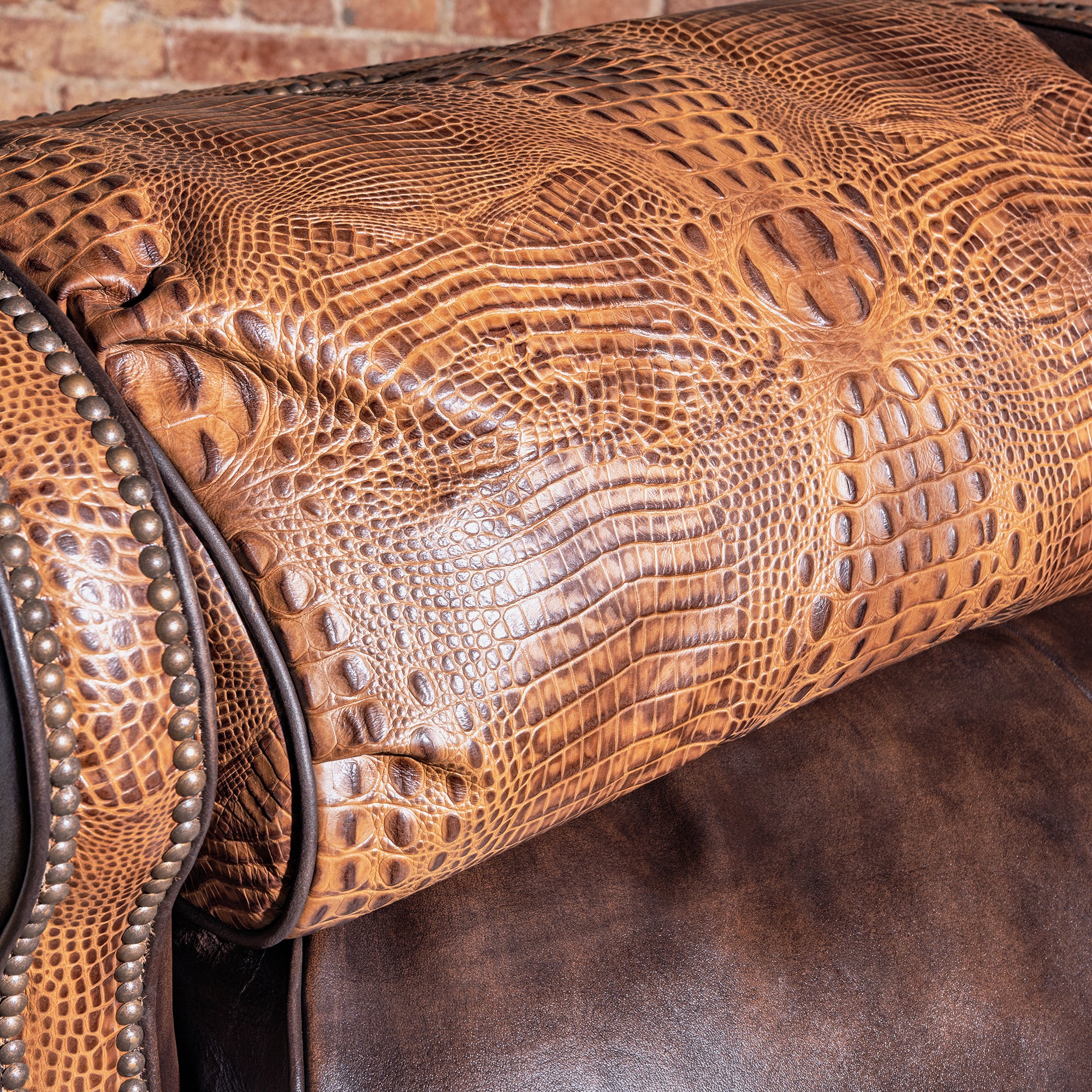Mojave Gatorline Recliner western bustleback leather recliner headrest detail with croc-embossed leather, nailhead trim, and wingback shape.