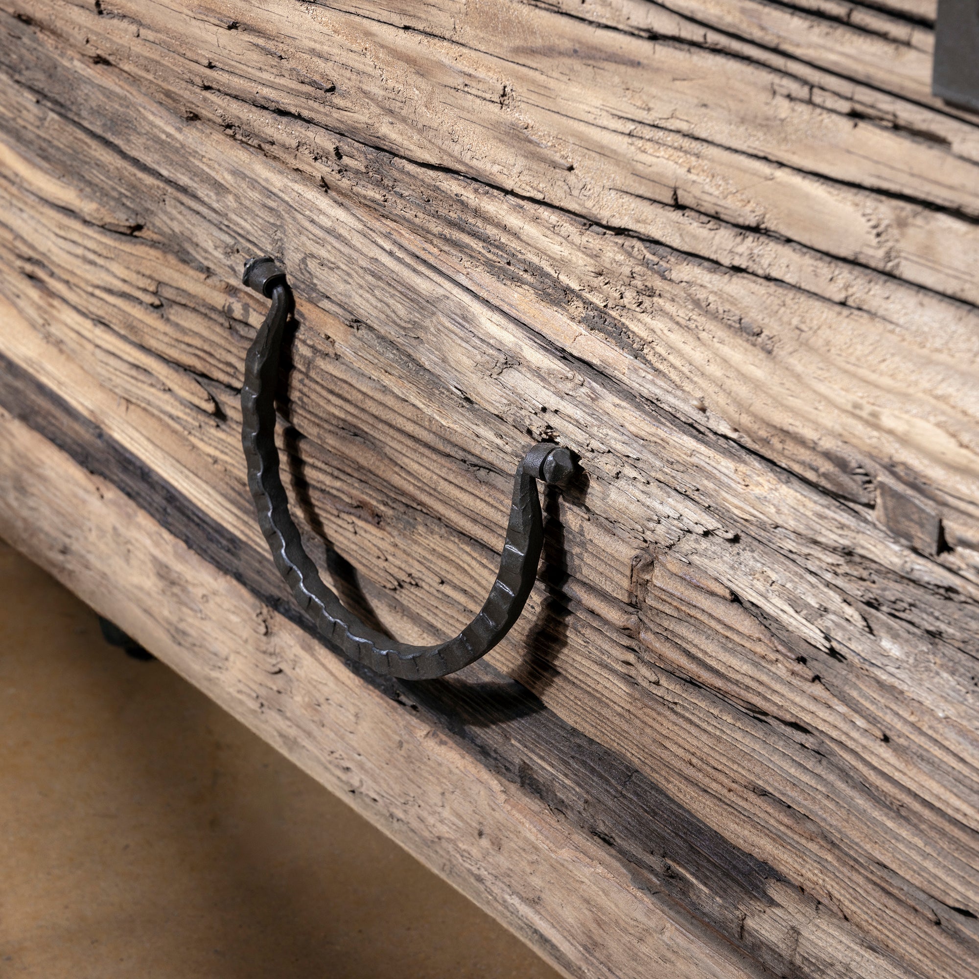 Iron latch detail on Outlaw Freight Trunk Coffee Table showing craftsmanship and patina