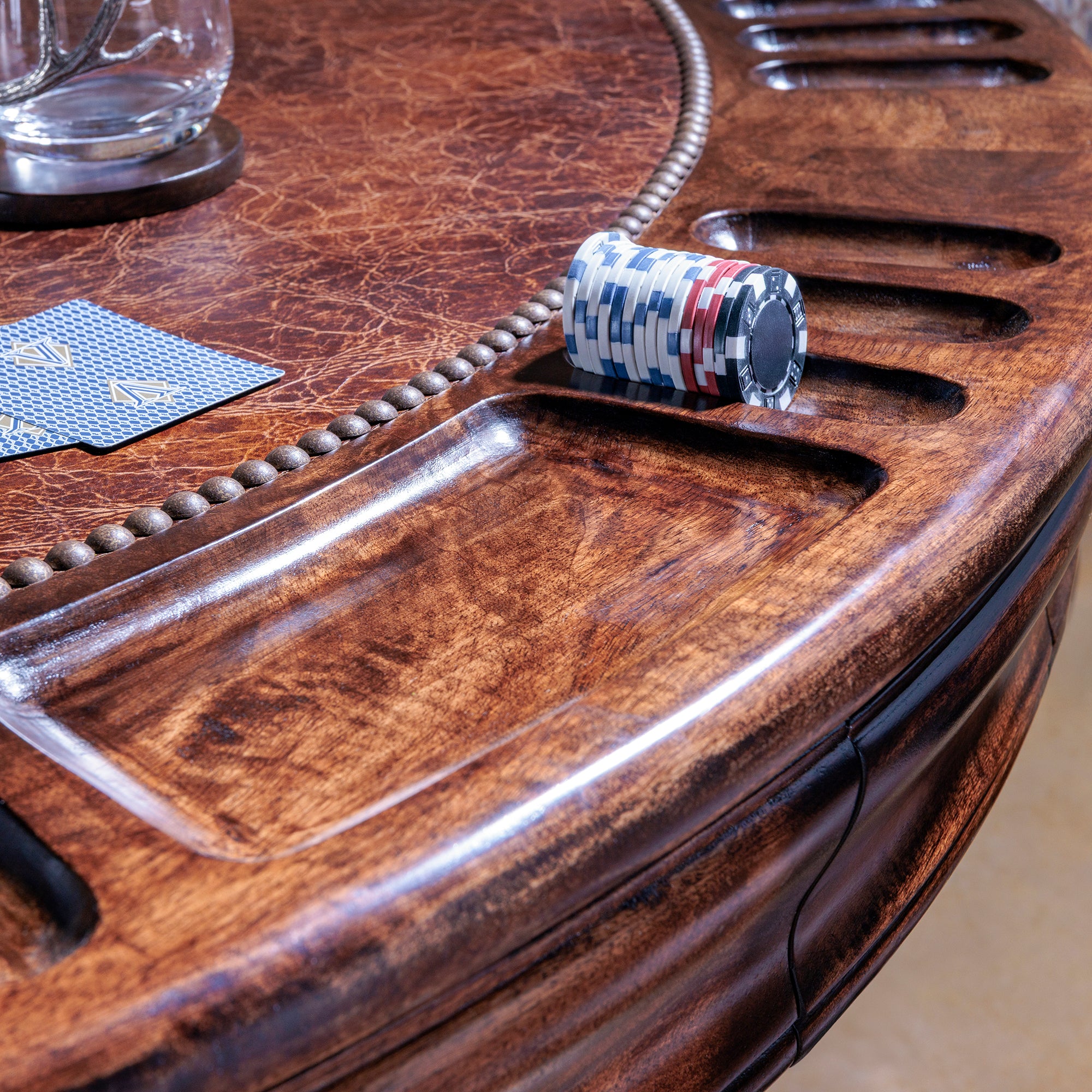 Leather inlay and chip slots on The Outlaw’s Round Poker Table