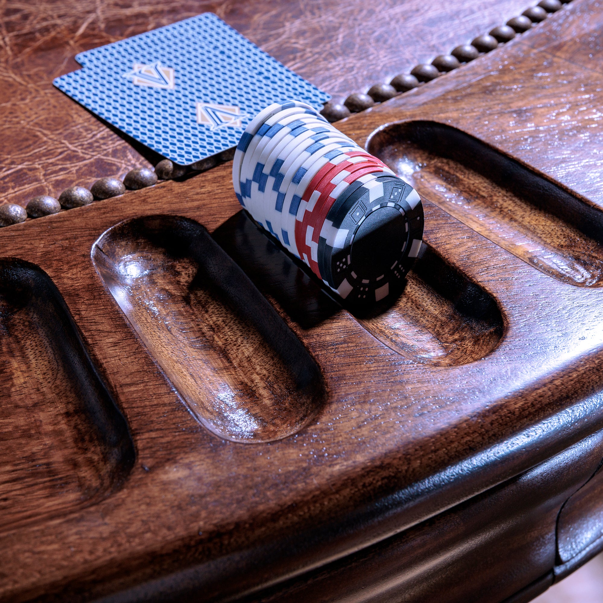 Leather inlay and chip slots on The Outlaw’s Round Poker Table
