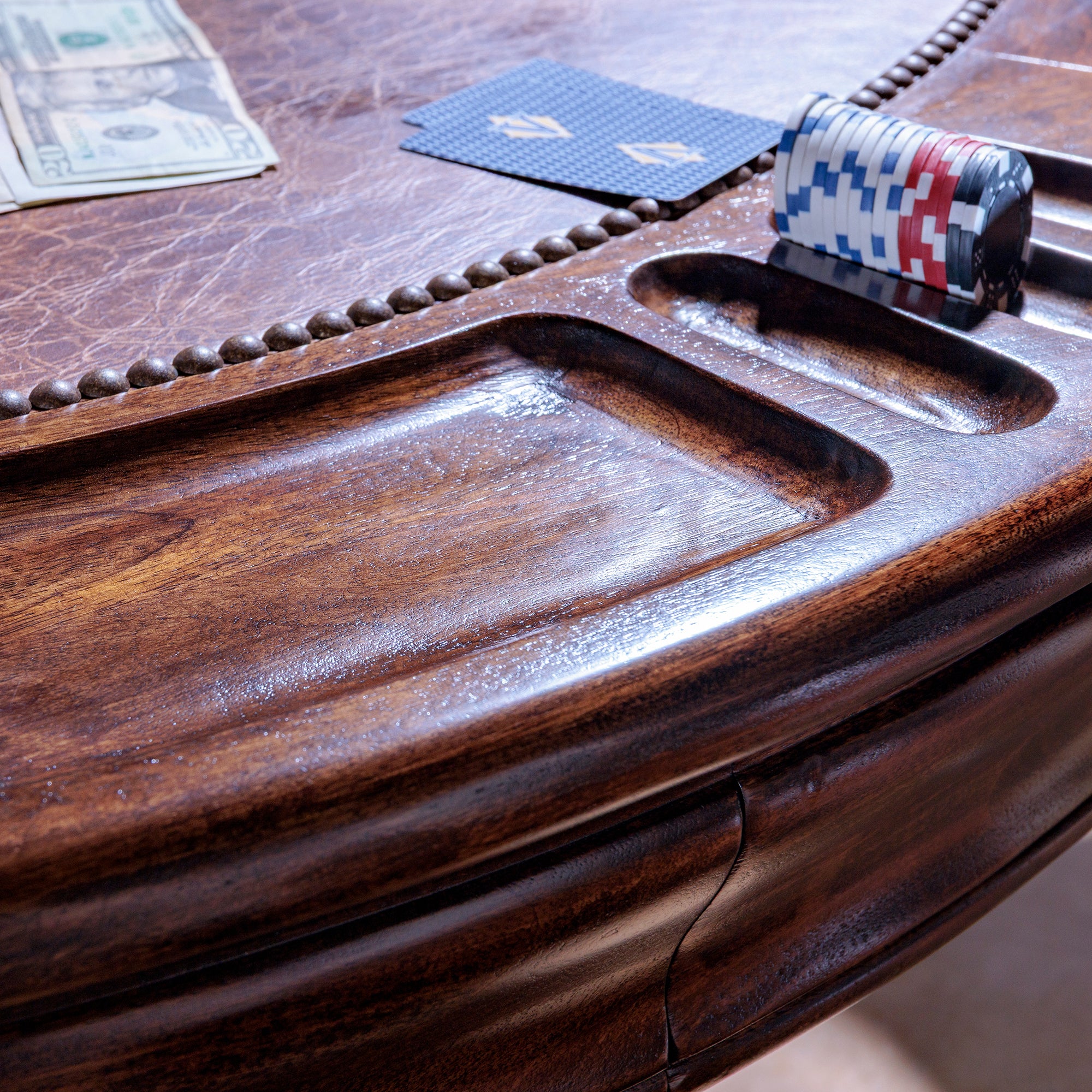 Leather inlay and chip slots on The Outlaw’s Round Poker Table