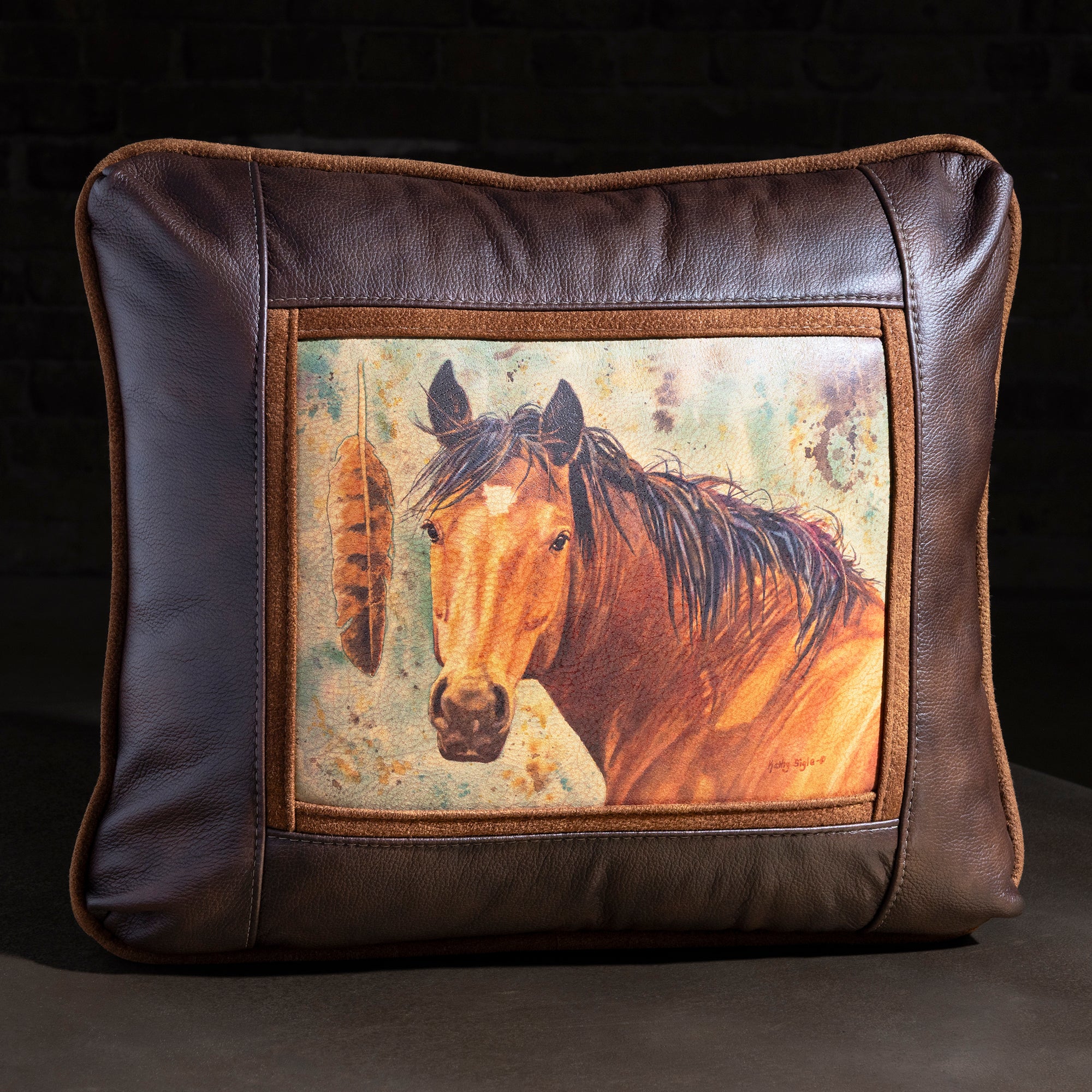 Painted Feather Buckskin Leather Western Throw Pillow western throw pillow with brown leather frame, buckskin horse portrait, and feather detail