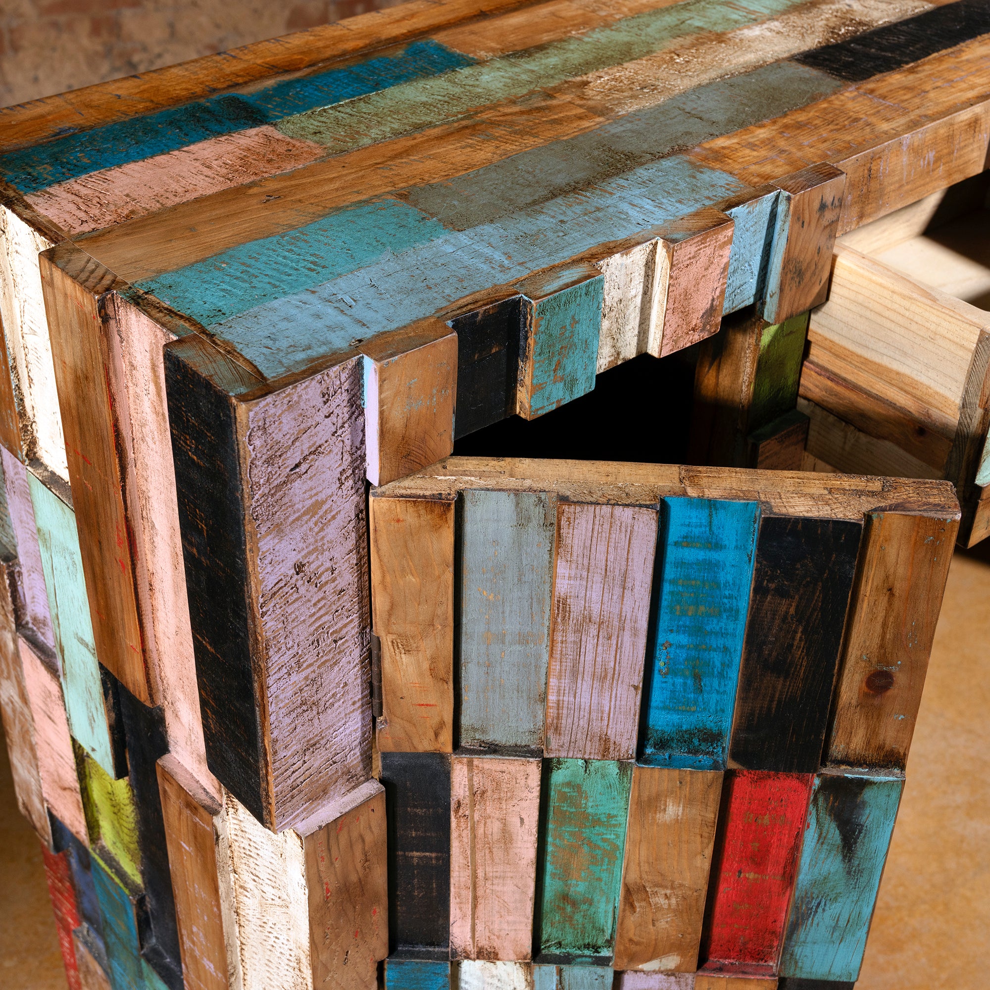 Close-up of Painted Mesa Console door with multicolor reclaimed wood texture