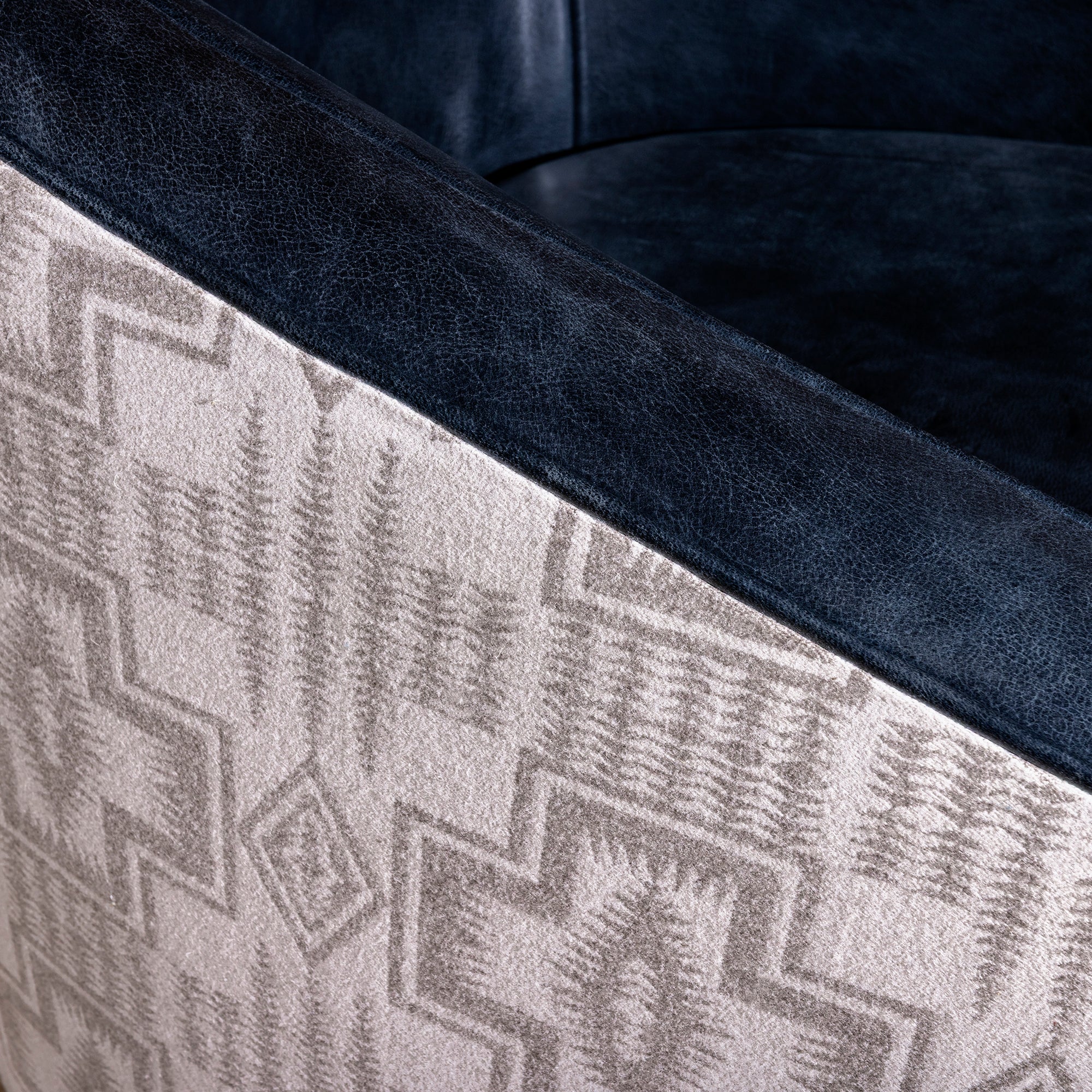 Close-up of leather arm and Pendleton fabric on the Silver Mesa Swivel Chair