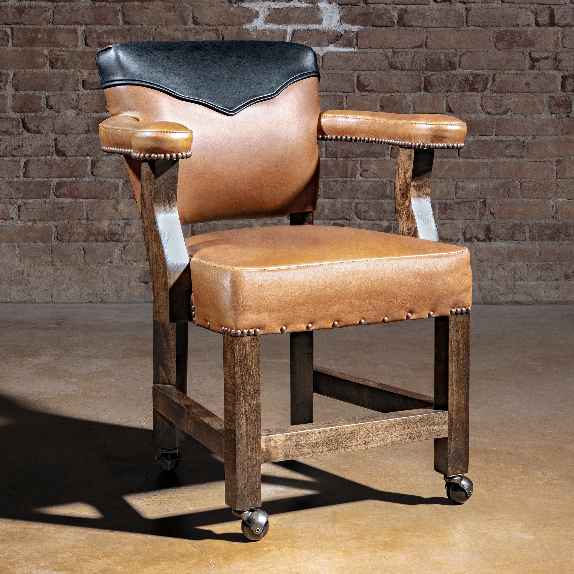 Presidio Dealer Chair western poker chair with leather arms, antique nailheads, solid alder wood legs, and rolling feet