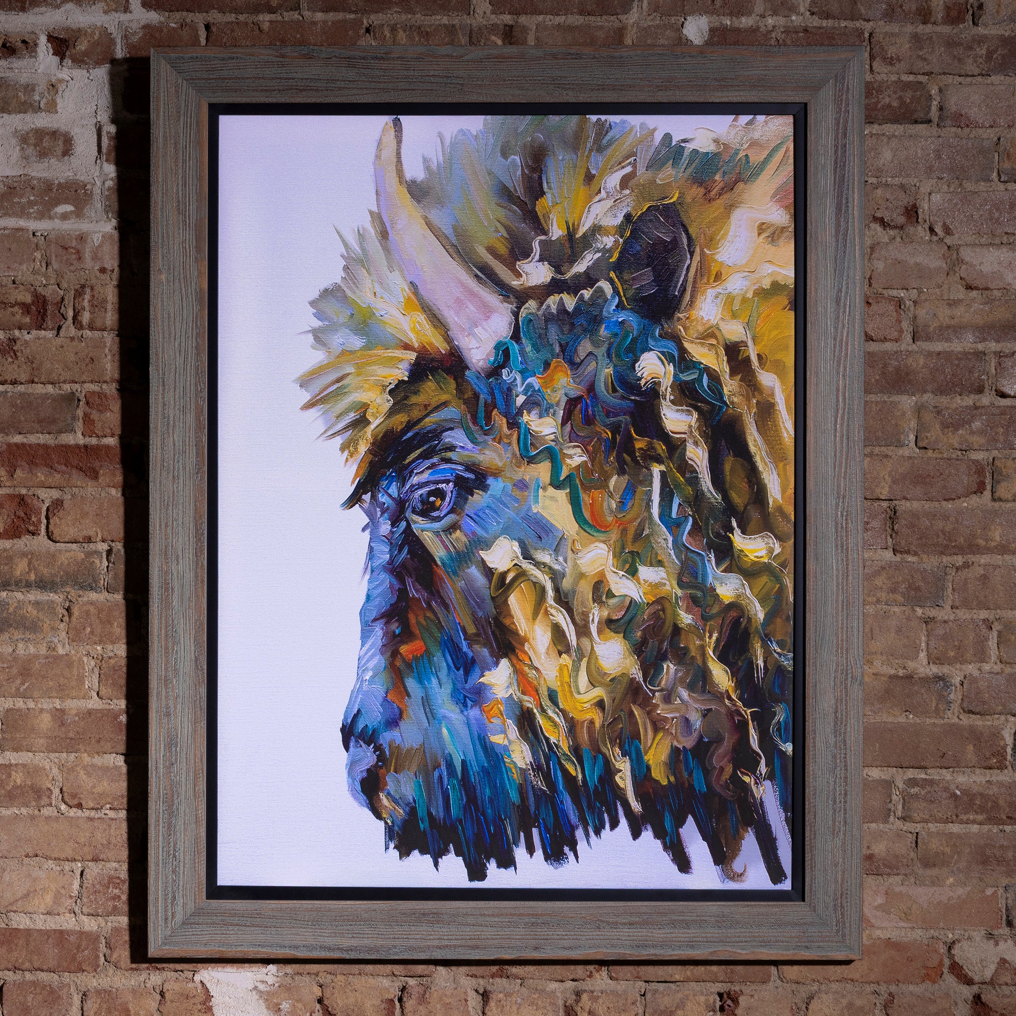 Prismatic Plains Buffalo Framed Western Wall Art western wall art with an abstract buffalo portrait, vivid blue tones, and gray wood frame