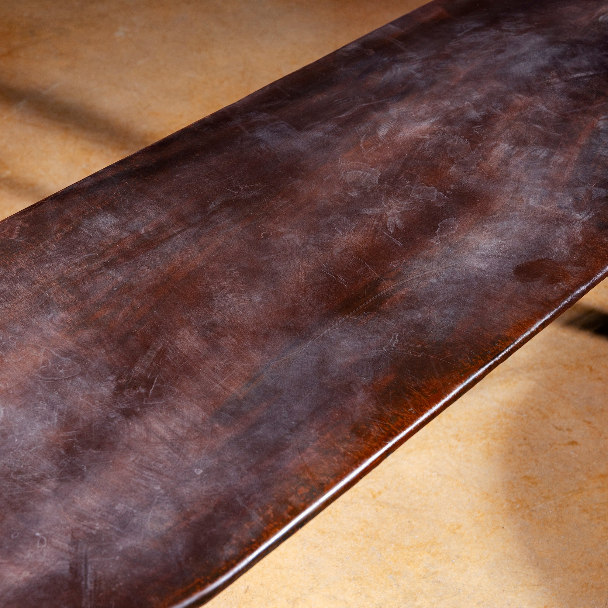 Distressed seat closeup on Railspur Gallery hand forged iron bench with rustic patina